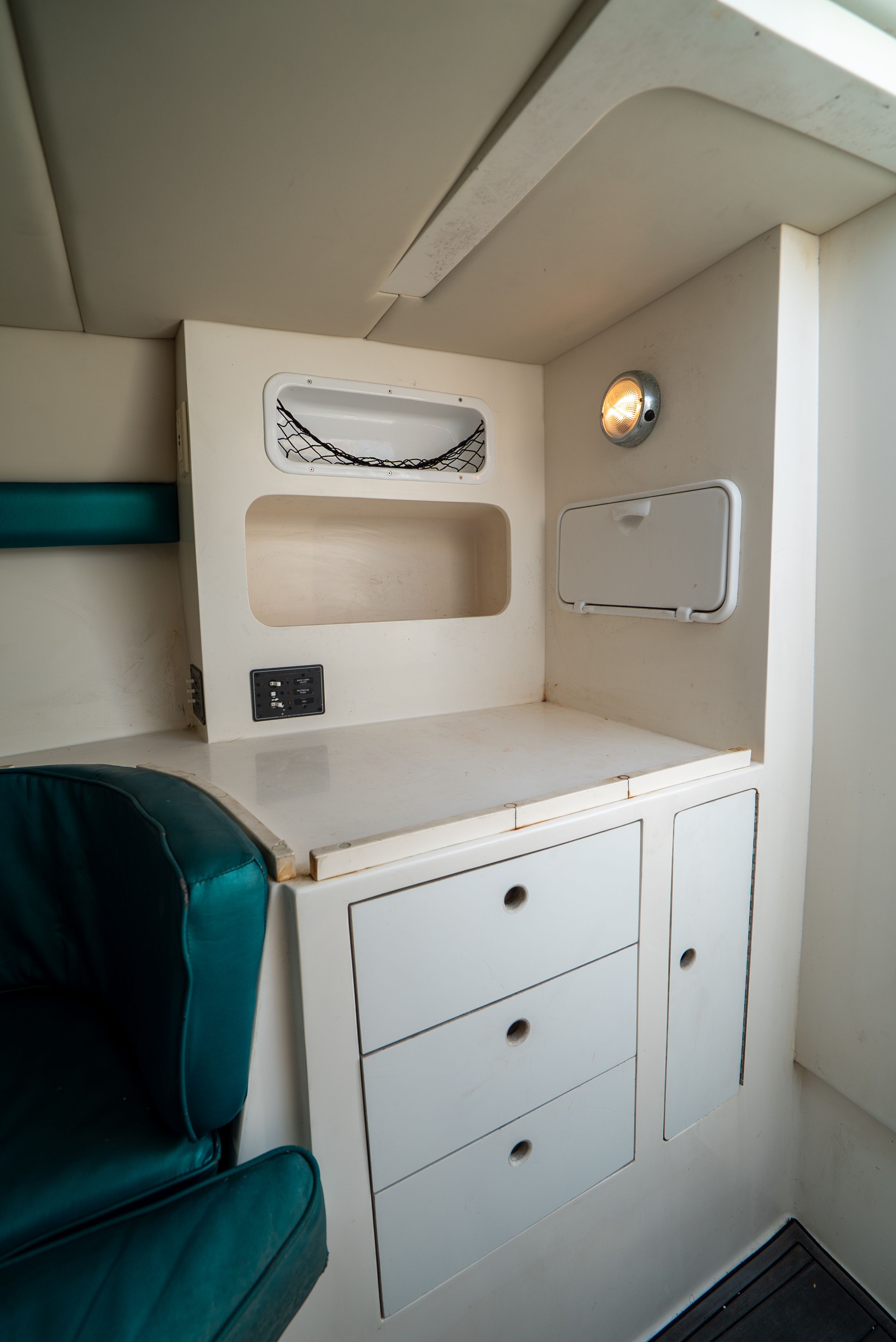 Interior of a 2006 Tempest Offshore 40 with cabinets and seating area.