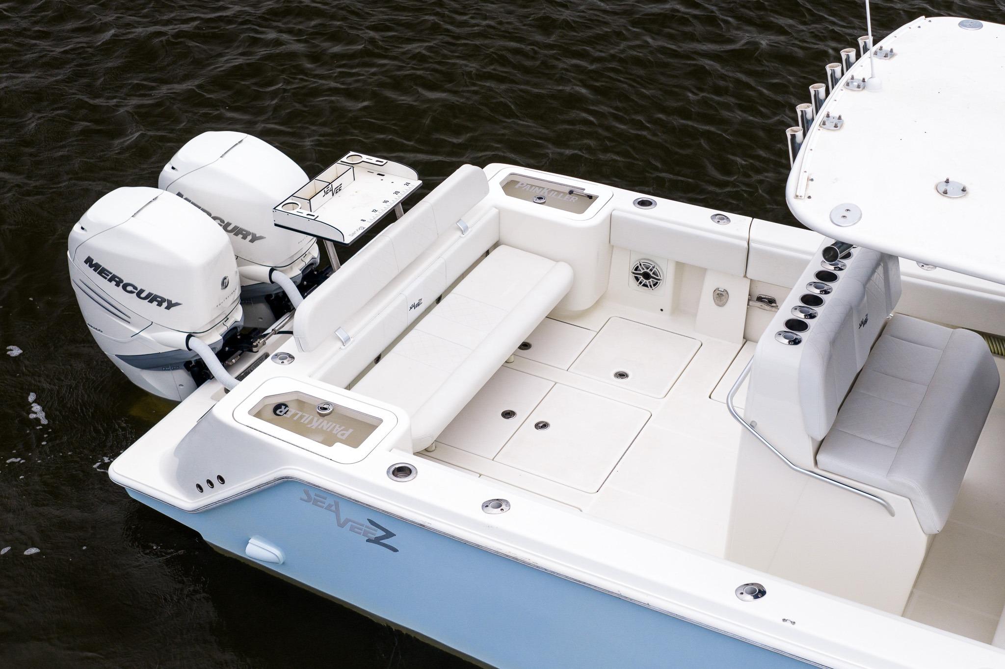 2019 SeaVee 322Z boat with twin Mercury engines, spacious deck, and seating area.