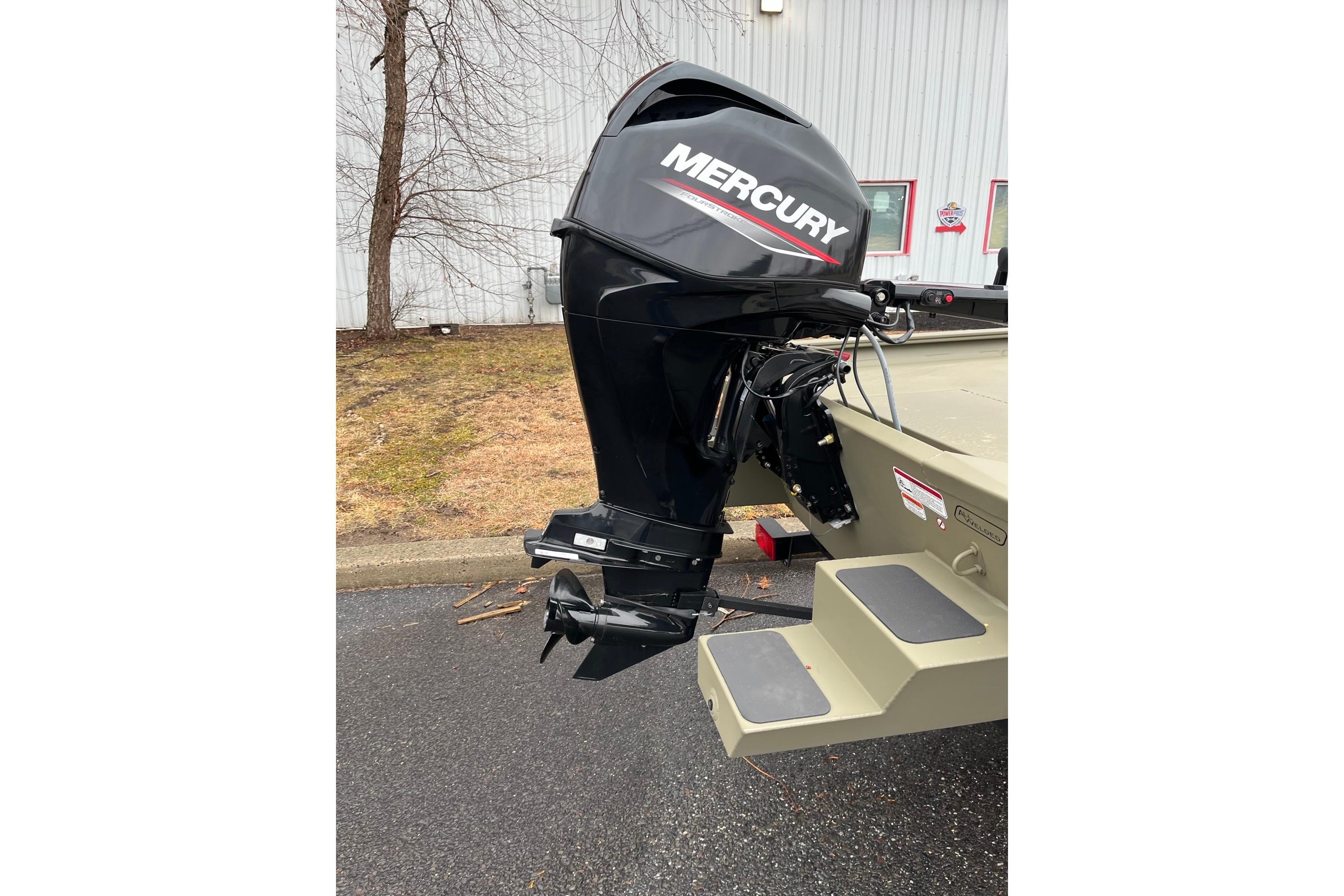 2026 Tracker Grizzly 1654 T Sportsman boat with Mercury outboard motor.