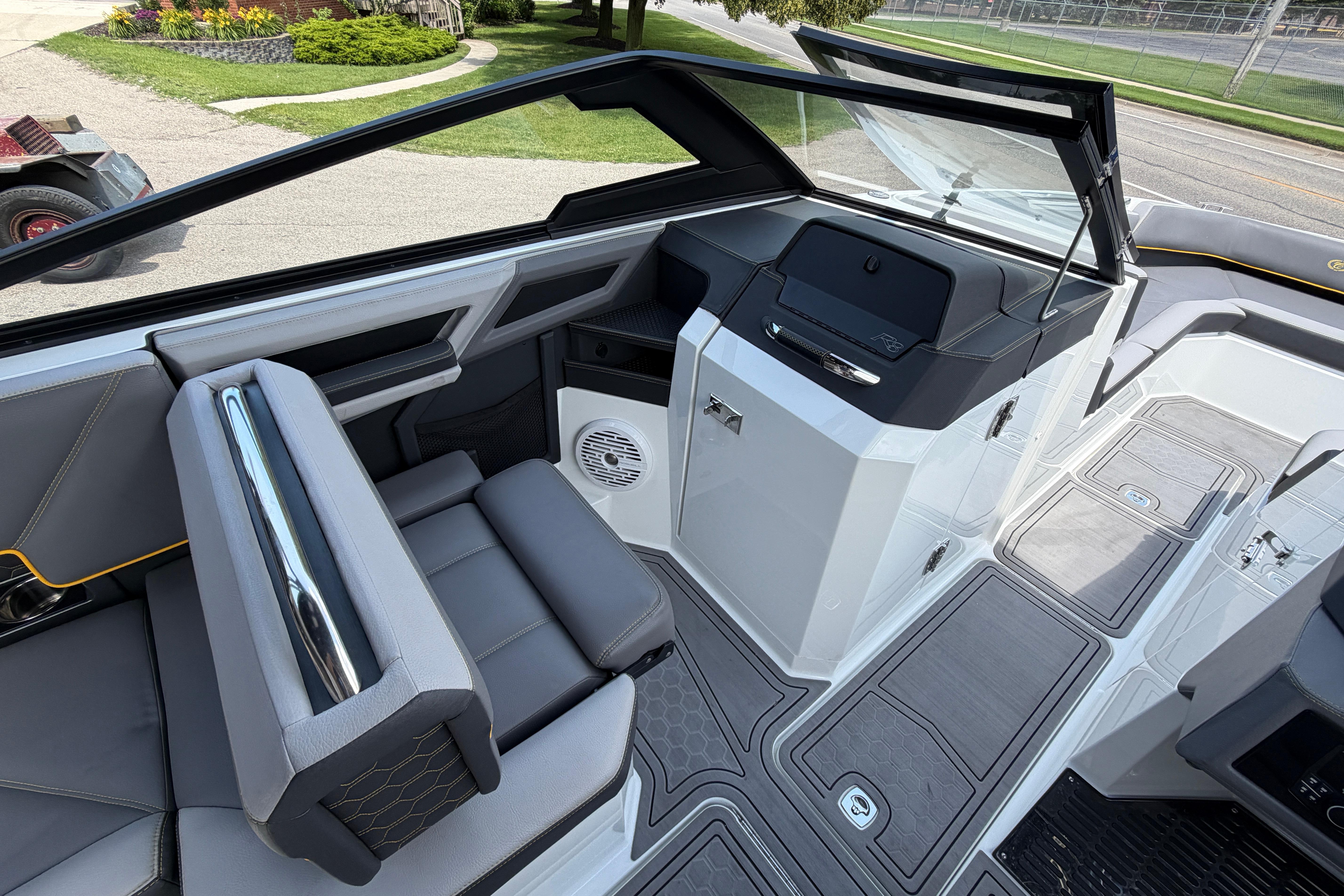 2021 Cobalt R8 Surf boat interior with sleek seating and modern dashboard design.