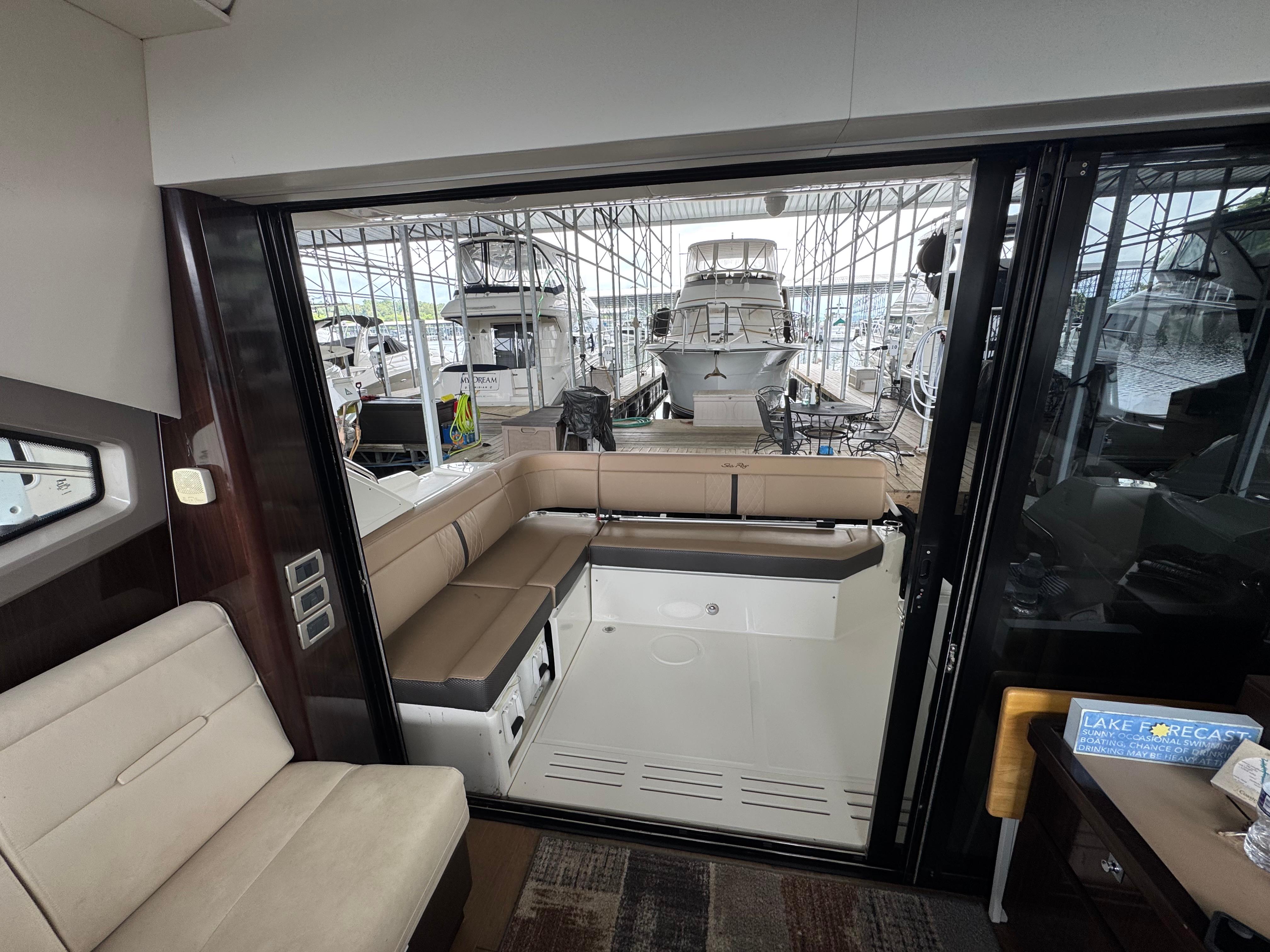 2017 Sea Ray Sundancer 400 interior with spacious seating and marina view.