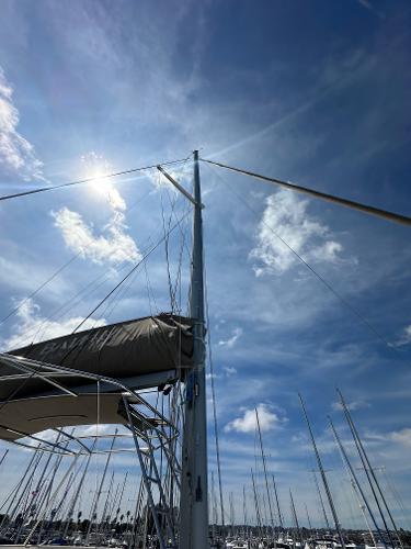 Sailboat mast under a bright blue sky, Bali 4.8 model, 2021.