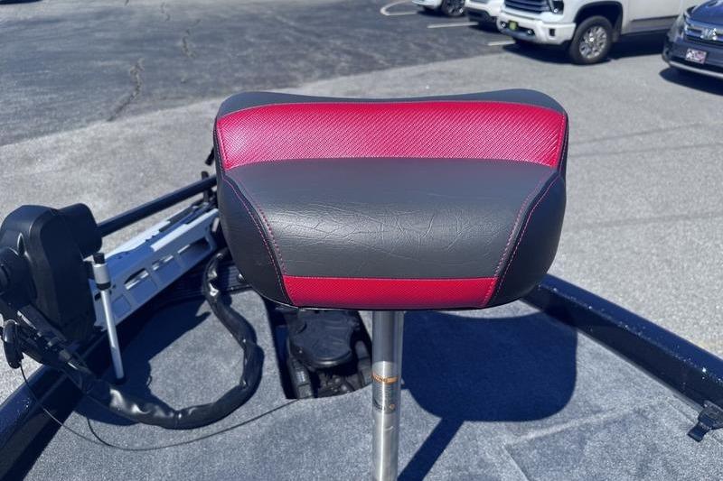 Red and black seat on a 2026 Phoenix 819 ZXL boat, parked outdoors.