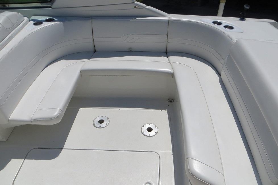 2003 Formula 330 Sun Sport boat interior with white cushioned seating.