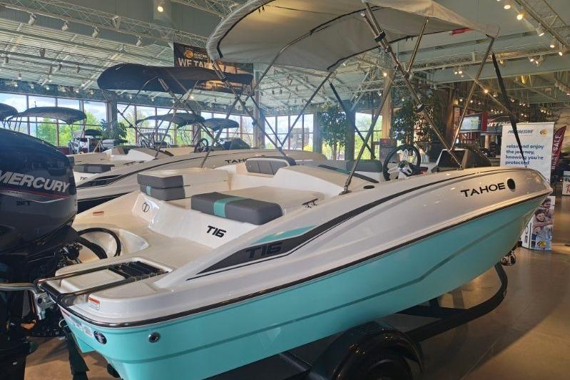 2026 Tahoe T16 boat in showroom, featuring sleek design and modern amenities.