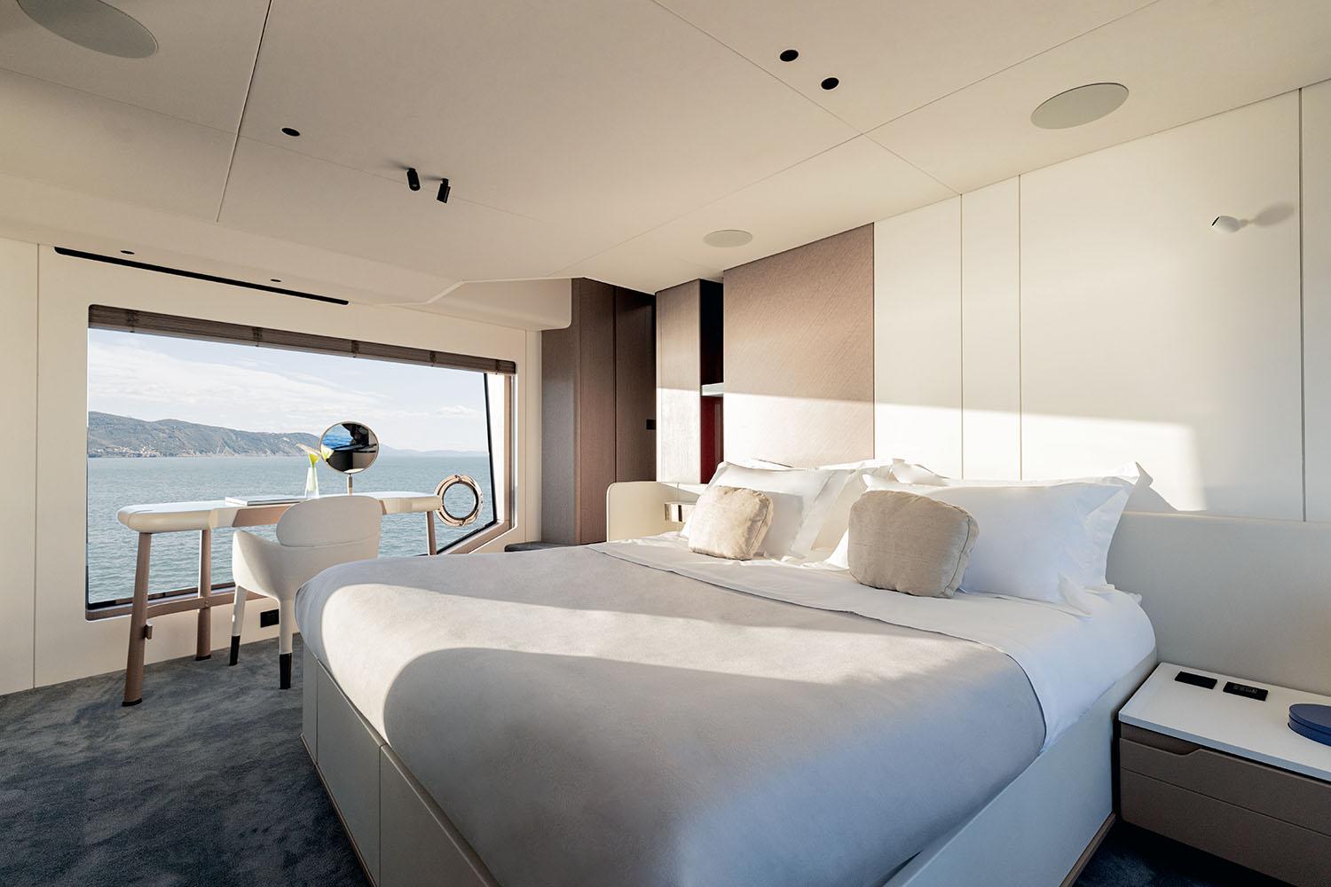 Luxurious bedroom interior of 2025 Azimut Grande 26M yacht with ocean view.