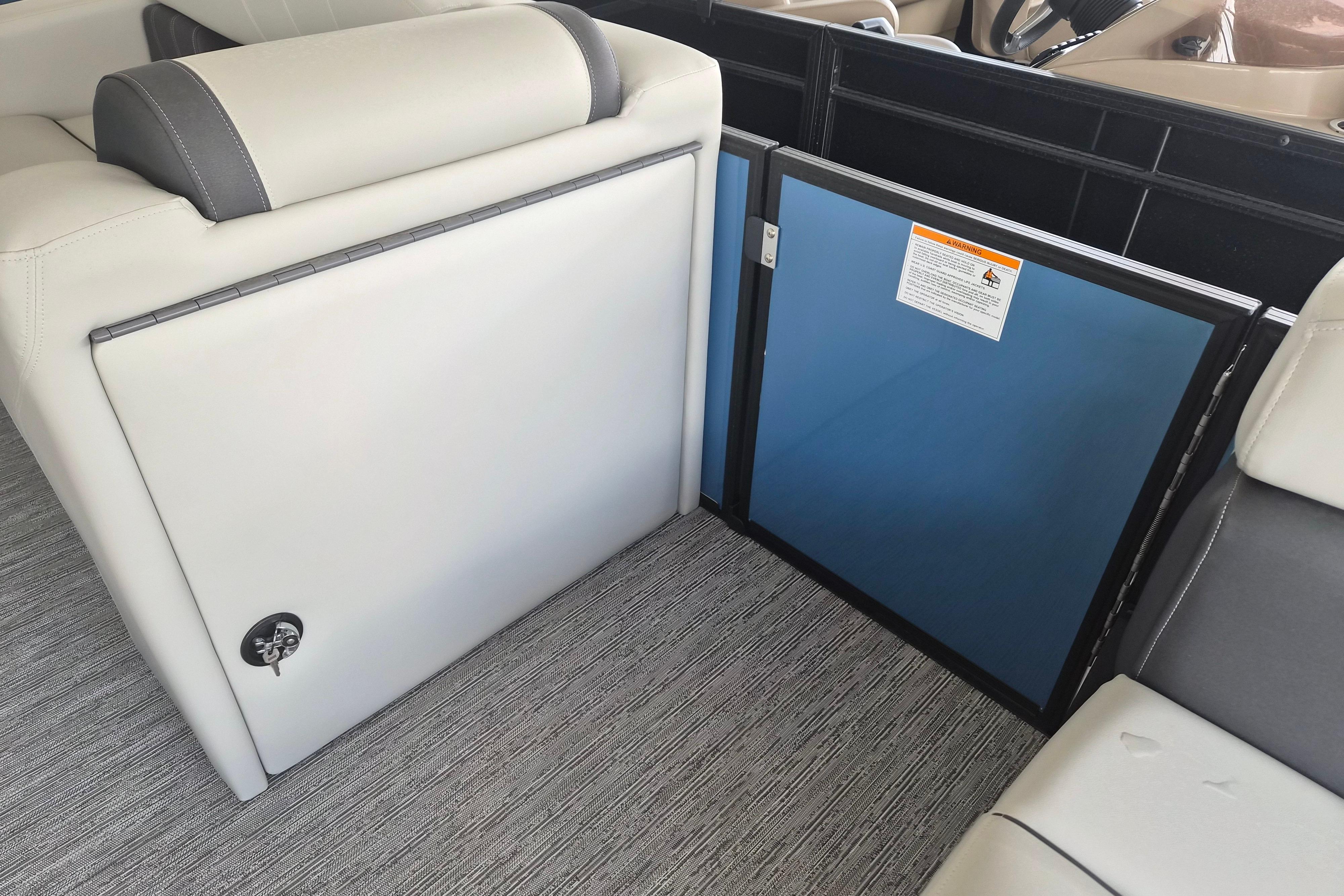 Interior of 2026 Sylvan Mirage Fish 820 Party Fish boat, featuring seating and storage.