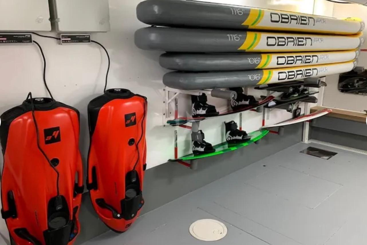 Water sports equipment storage with O'Brien paddleboards and red ISA 120 devices, 2006 model.