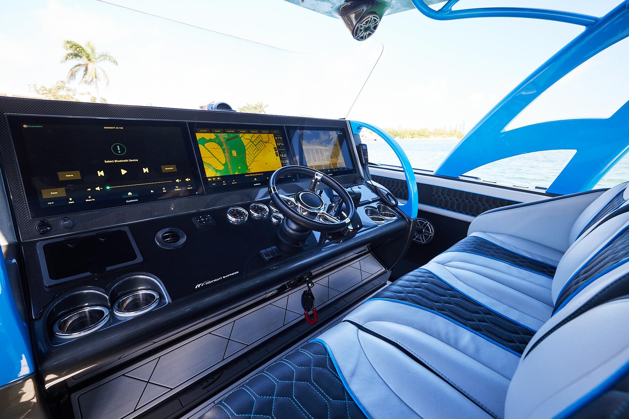 2023 Midnight Express 43' Solstice boat interior with modern dashboard and seating.