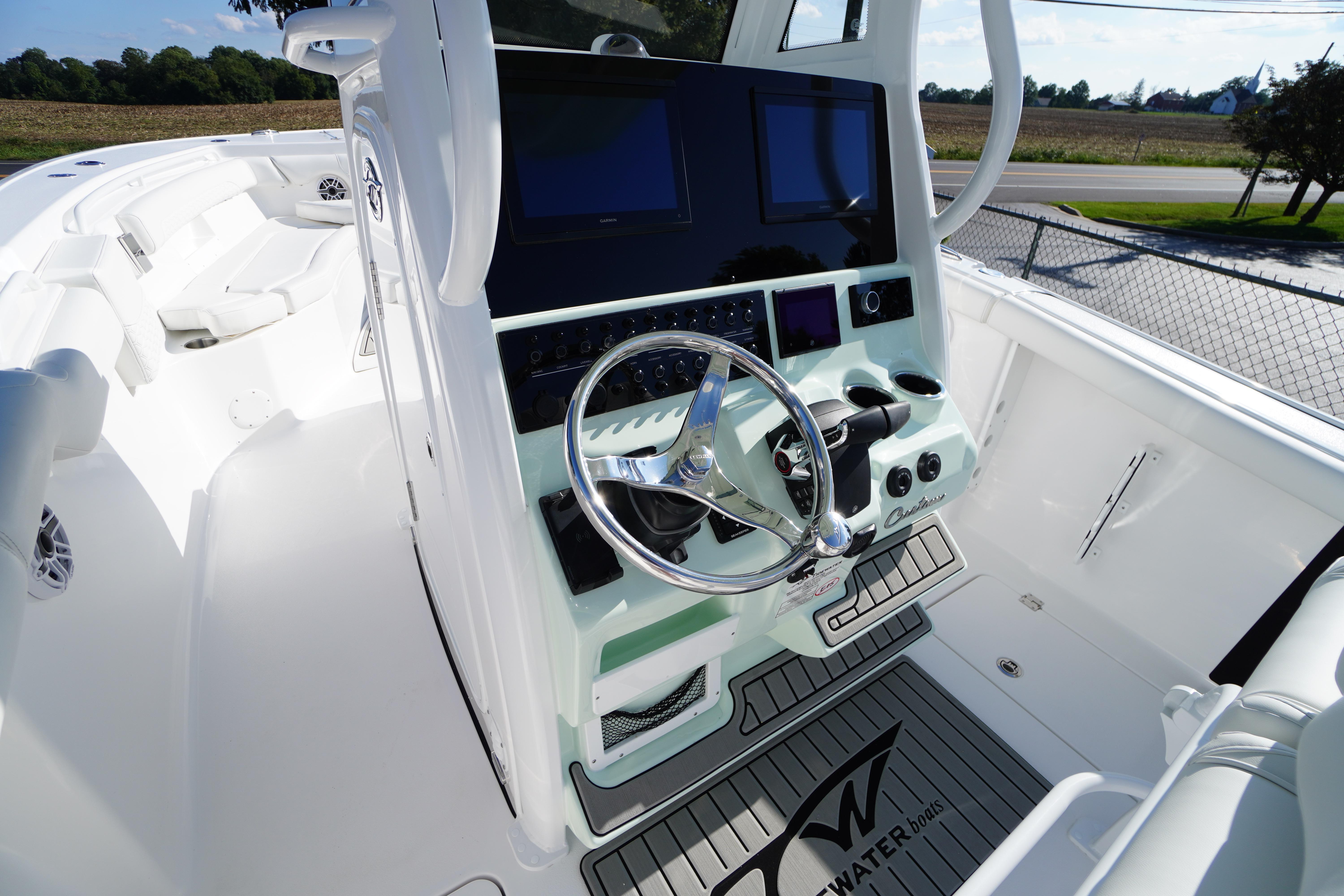 2026 Tidewater 272 LXF boat cockpit with modern steering and navigation displays.