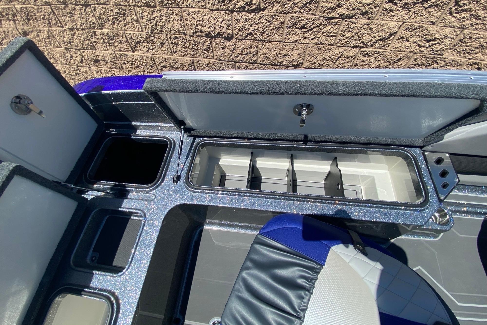 2026 Ranger 622FS Pro boat storage compartments with open lids, showcasing interior design.