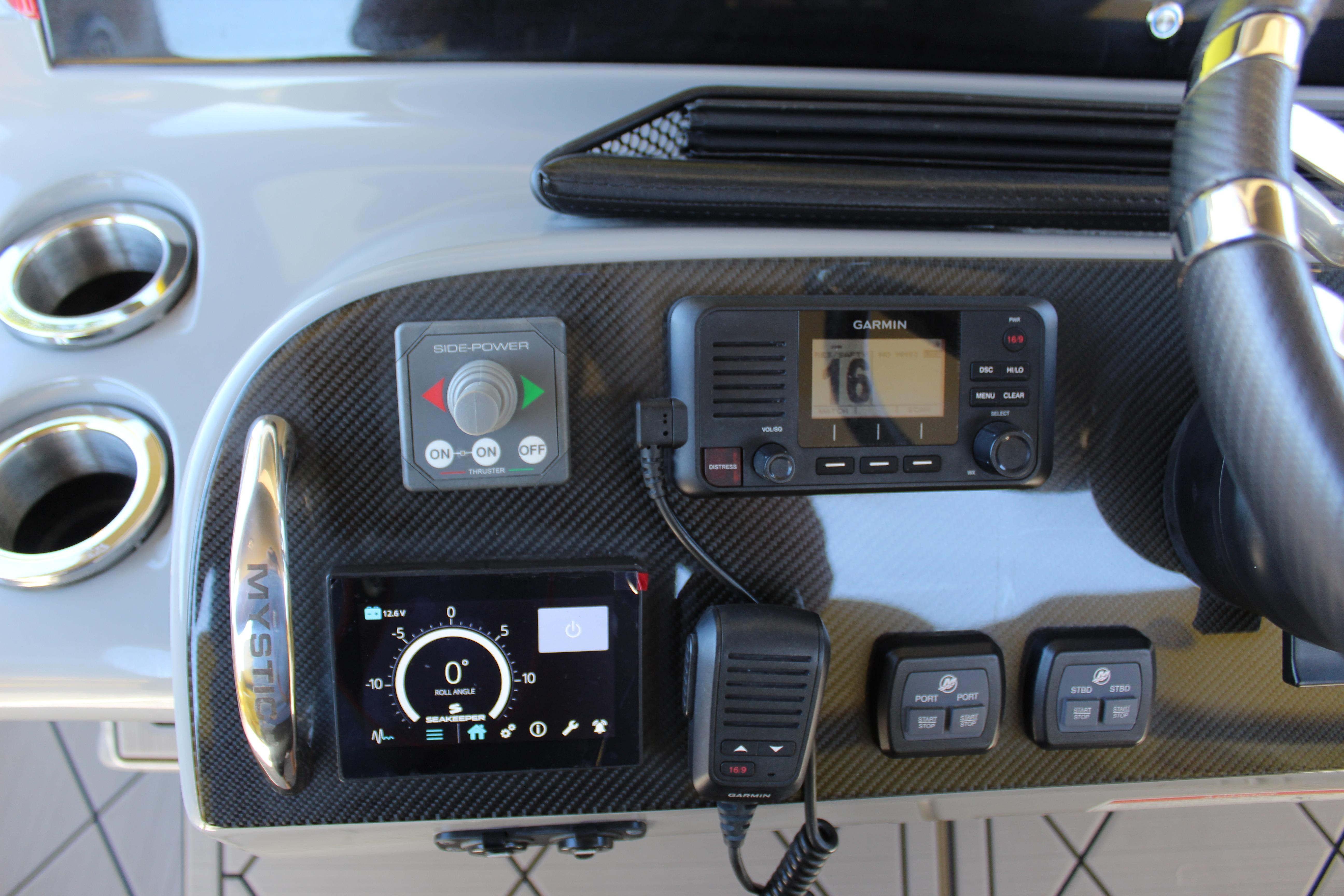 Control panel of a 2021 Mystic M4200 boat with Garmin navigation system.