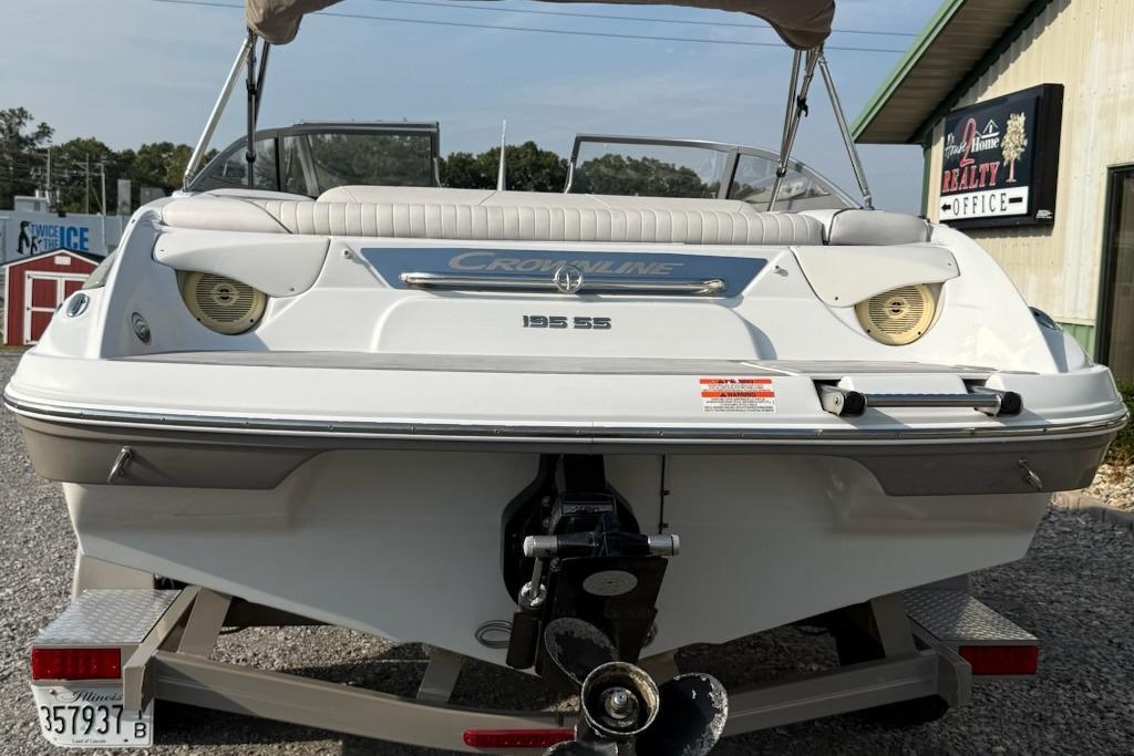 Rear view of a 2012 Crownline 195 SS boat on a trailer.