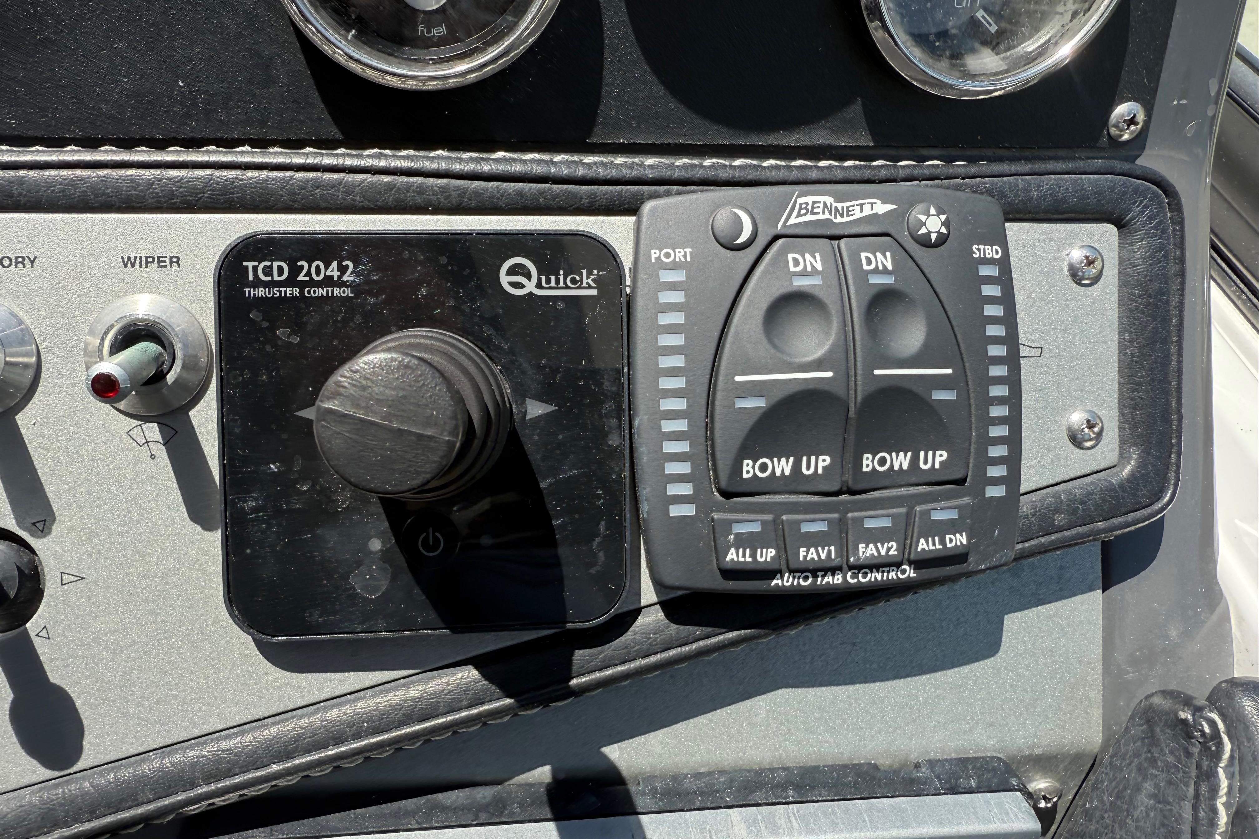 Control panel of a 2017 Four Winns V275 boat with thruster and tab controls.