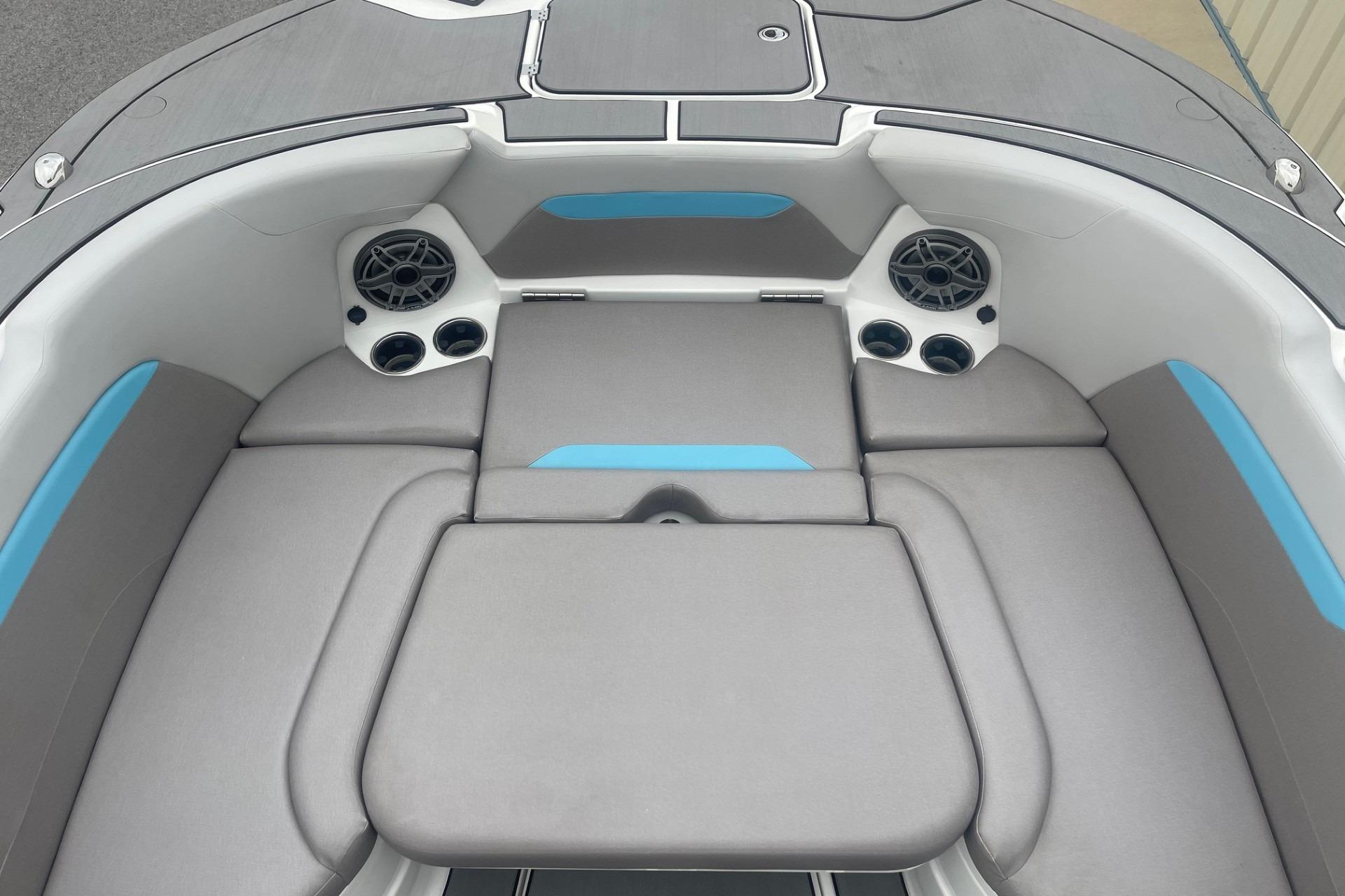 2025 Hurricane Center Console 24 OB boat interior with cushioned seating and built-in speakers.