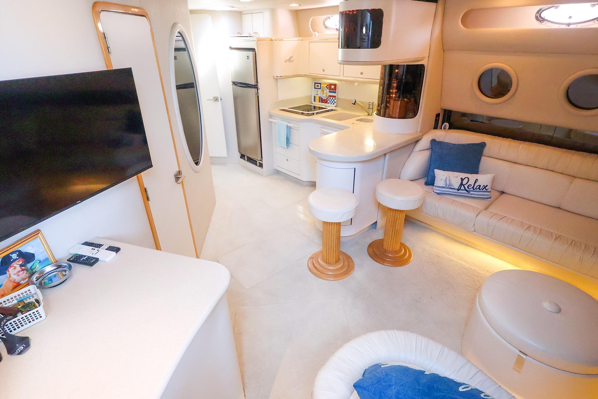 Luxurious interior of a 1998 Sea Ray 500 Sundancer yacht with modern amenities.