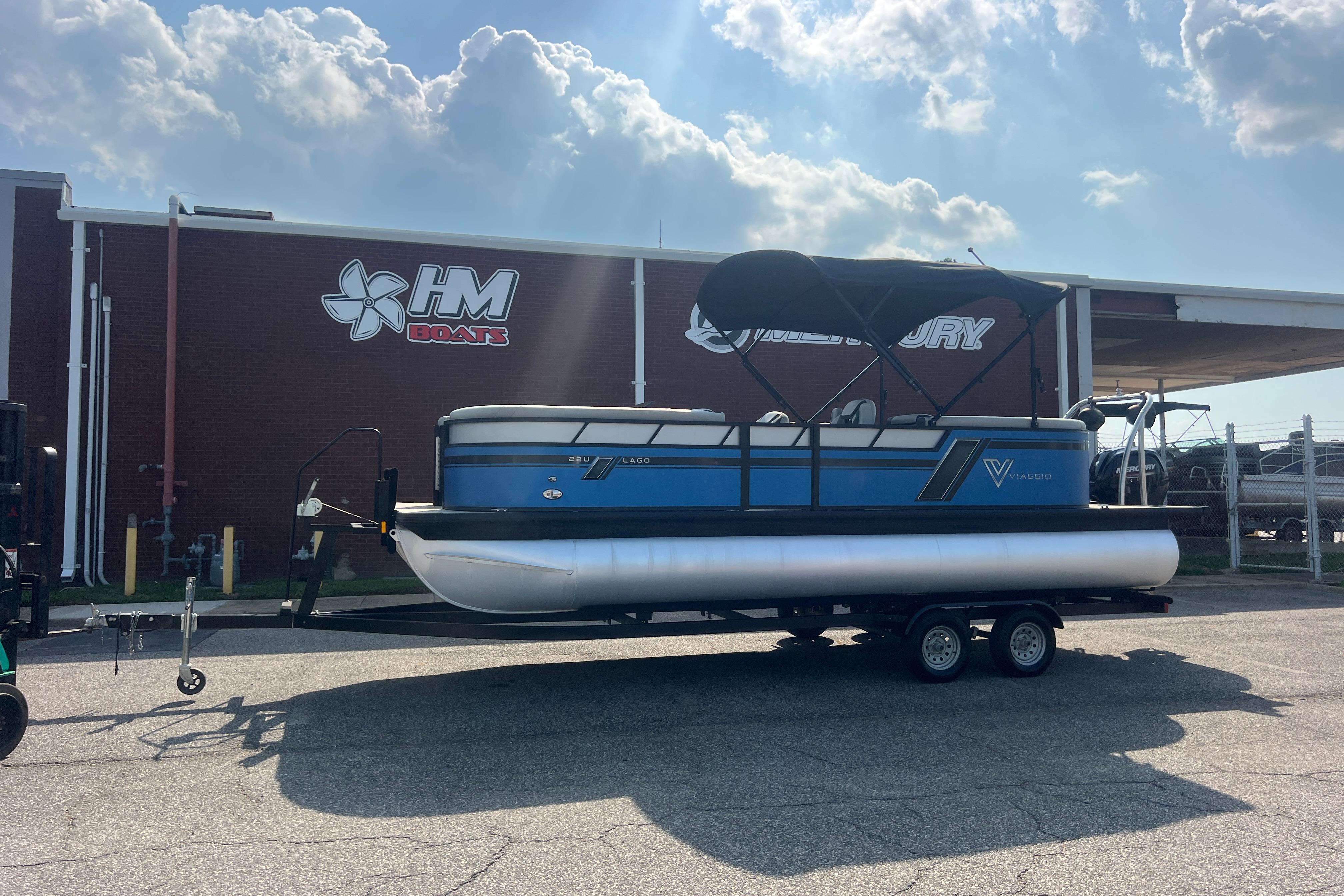 2022 Viaggio Lago V-U 22 pontoon boat on trailer outside HM Boats building.