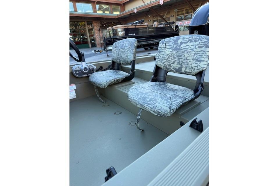 2026 Tracker Grizzly 1754 SC boat interior with camo seats.