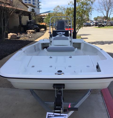 2025 Mako Pro Skiff 15 CC boat on display outdoors.