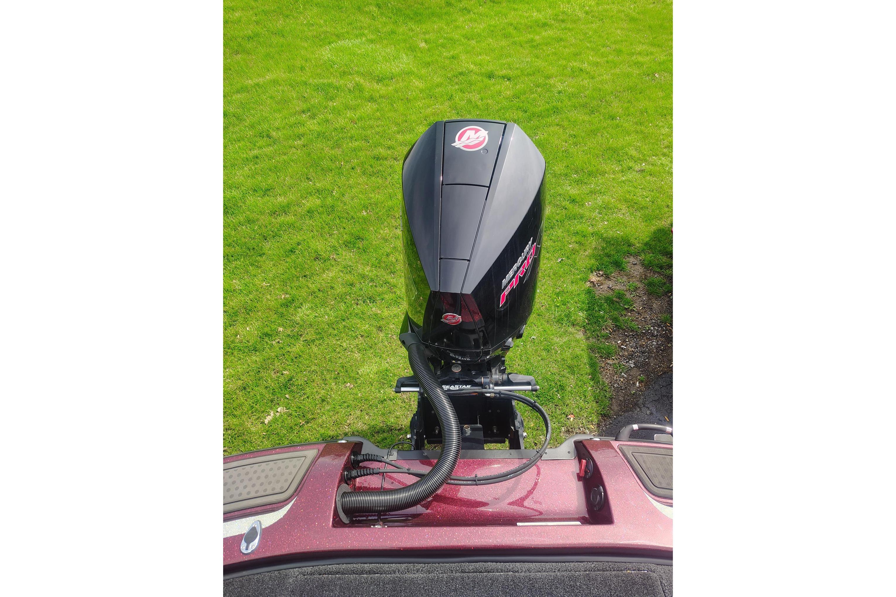 2024 Nitro Z21 XL boat engine on grassy background.