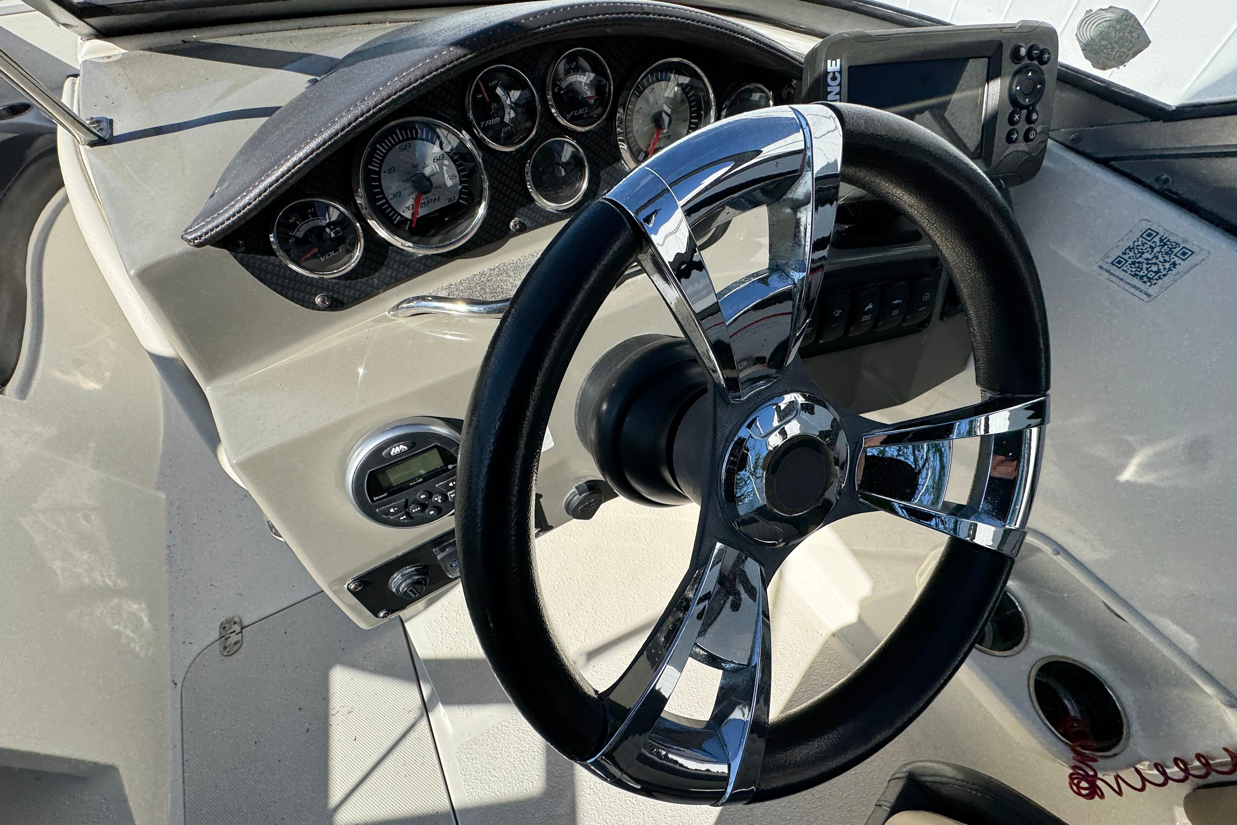 Steering wheel and dashboard of a 2018 Stingray 204 LR boat.