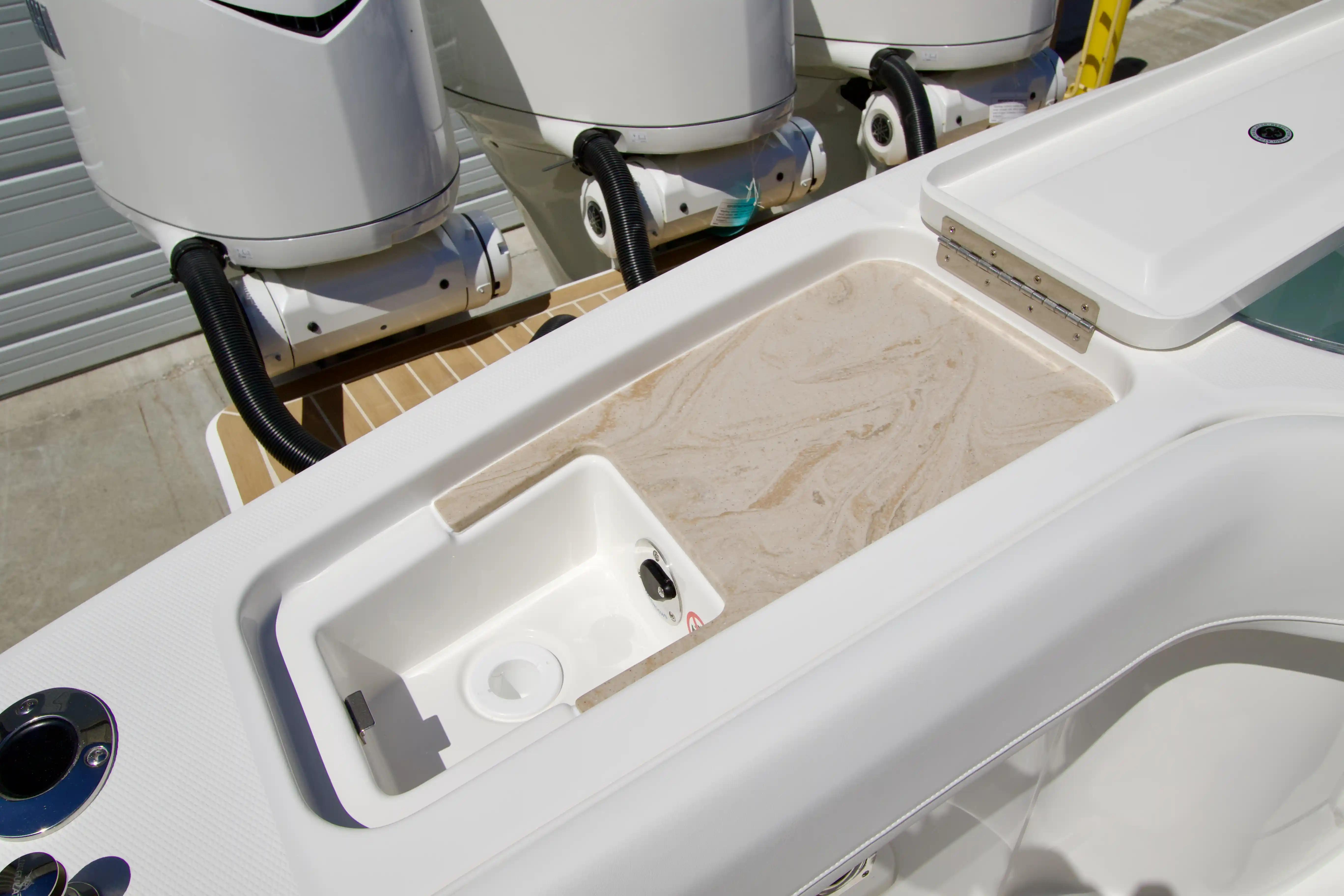 Regulator 35 boat interior with storage compartments and outboard motors, 2027 model.