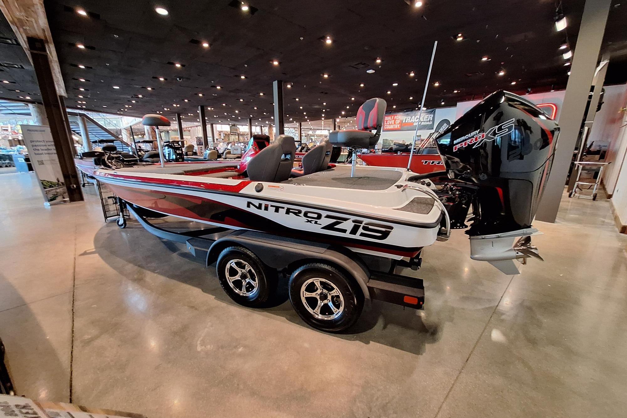 2026 Nitro Z19 XL Pro boat displayed indoors with sleek design and powerful engine.