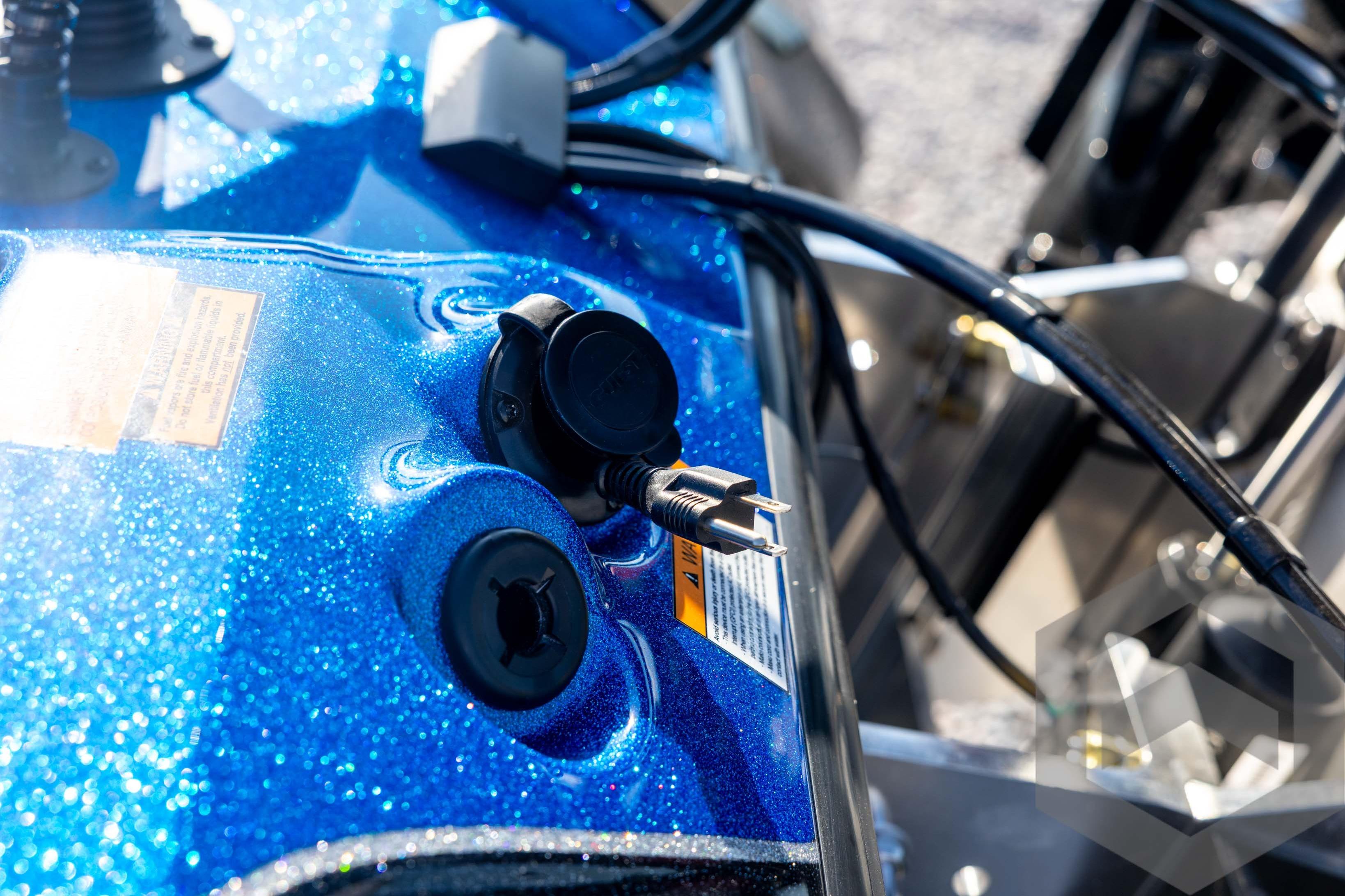 Close-up of 2026 Skeeter ZXE20 boat's blue metallic surface with electrical connectors.