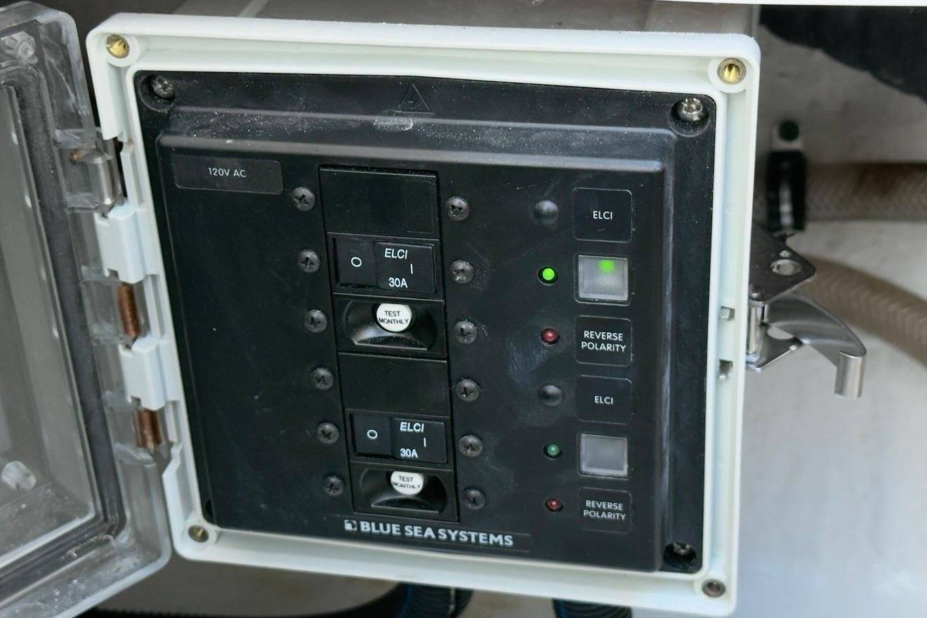 Electrical panel on 2022 Intrepid 407 Panacea boat by Blue Sea Systems, showing ELCI and reverse polarity indicators.