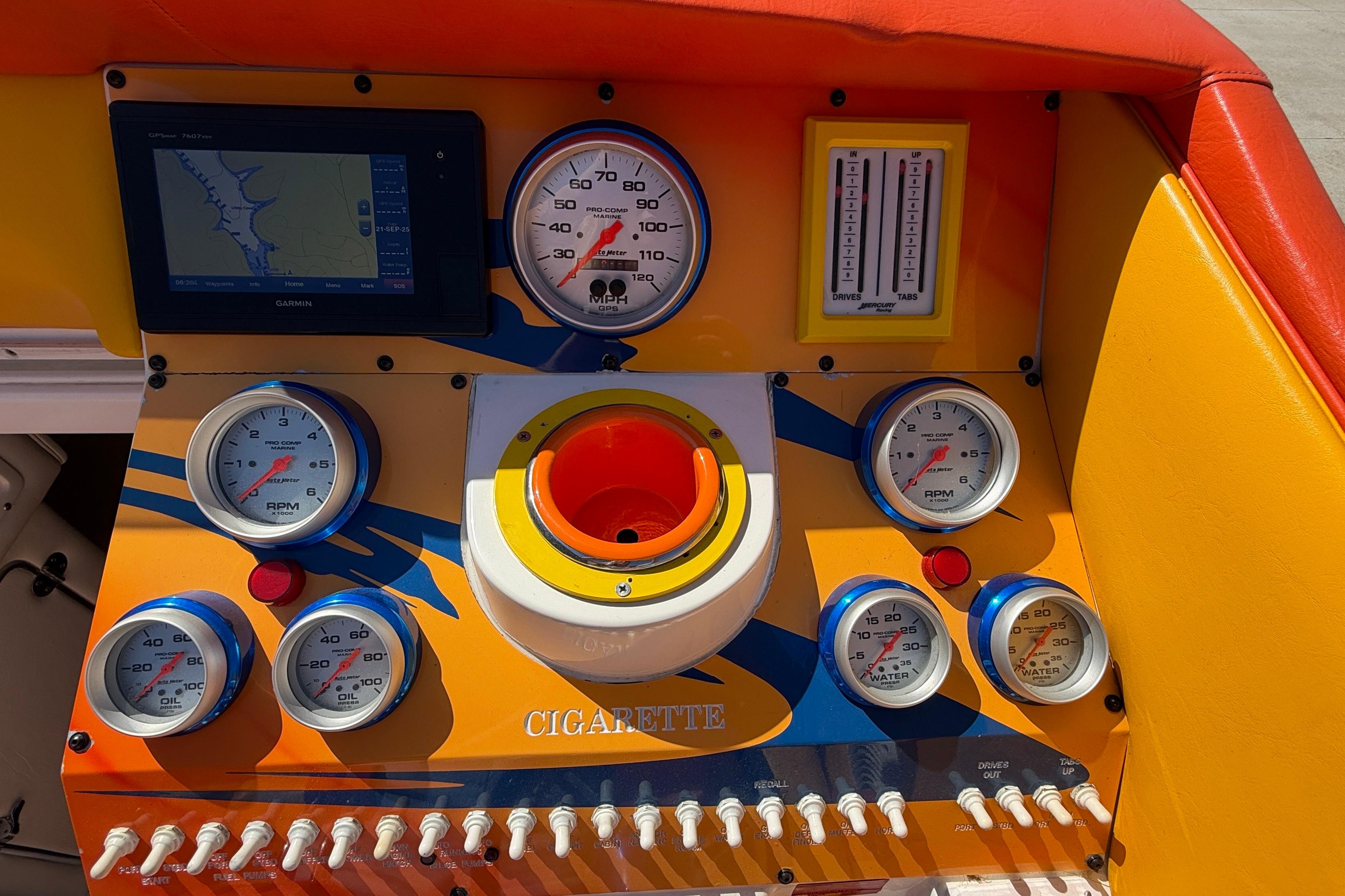 Dashboard of a 2002 Cigarette 35' Cafe Racer boat with gauges and controls.