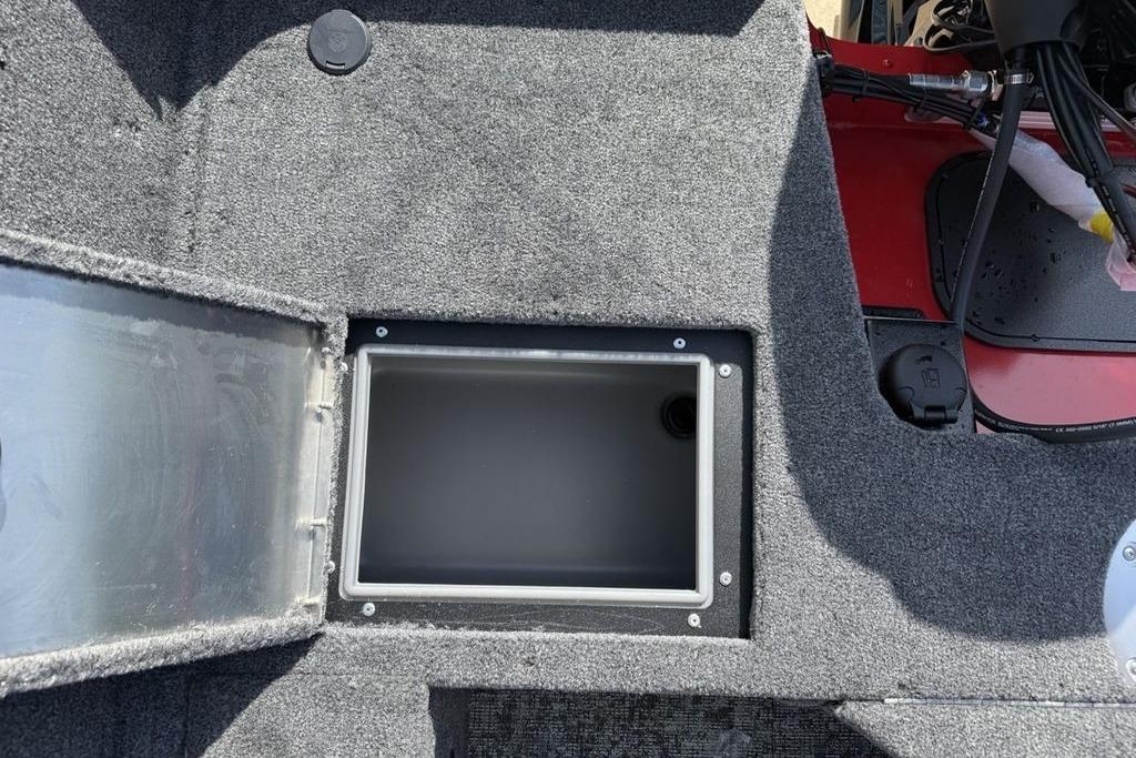 Interior view of a 2026 Tracker Pro Guide V-16 SC boat storage compartment.