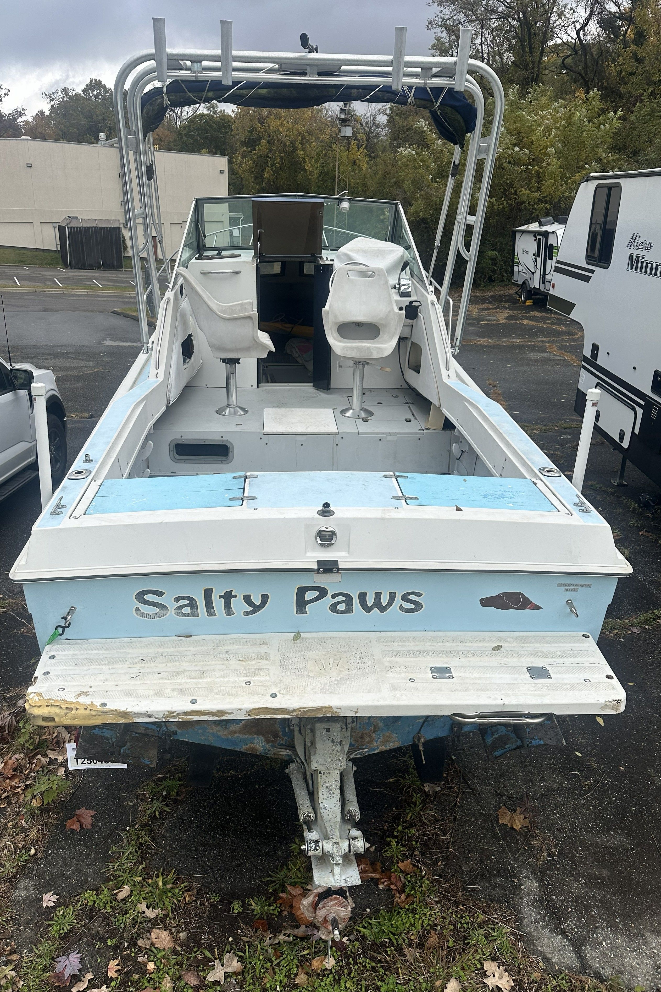 Rear view of a 1989 Wellcraft 250 Sportsman named "Salty Paws."