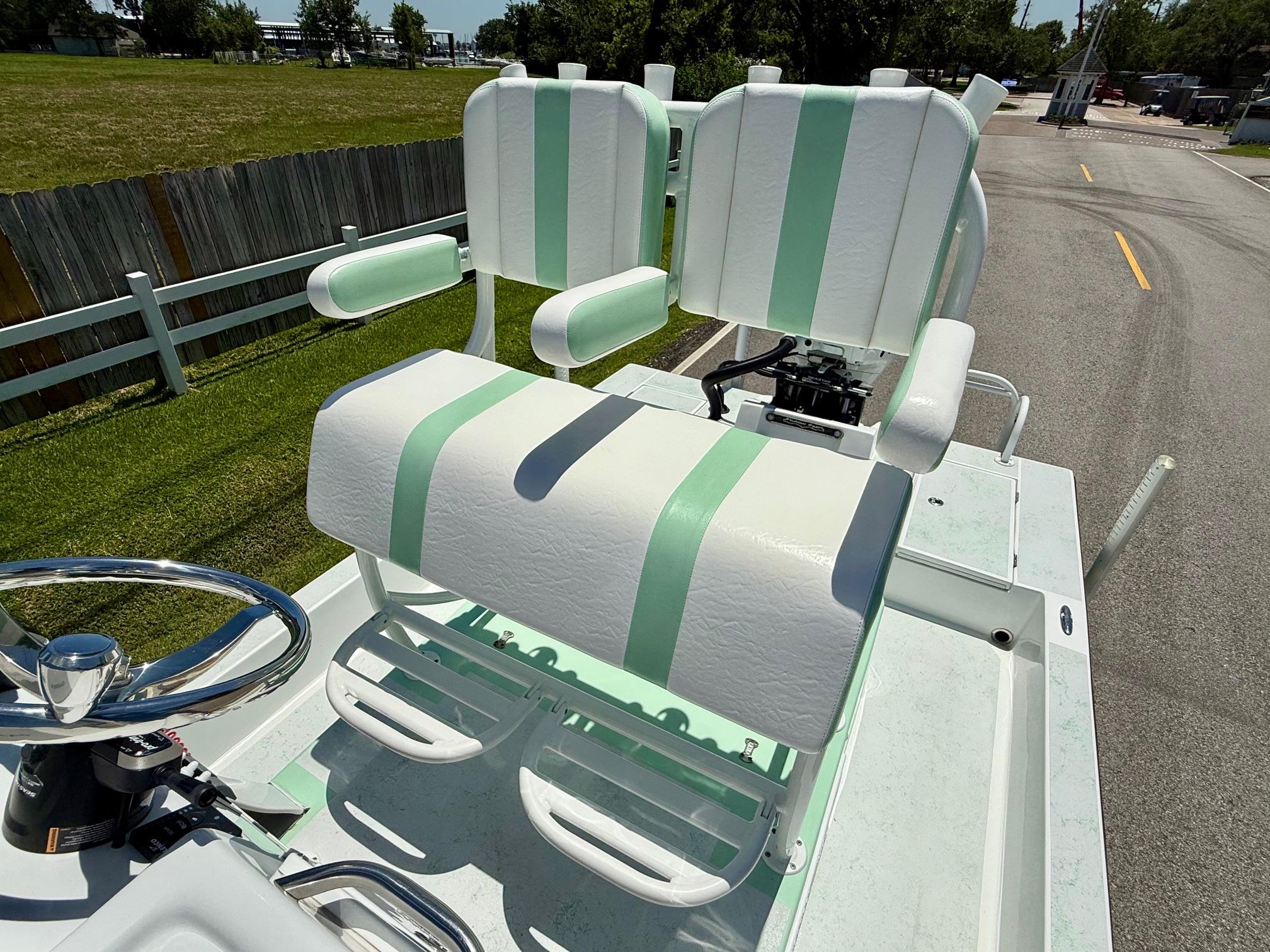 2023 Shallow Sport 24 Sport boat with dual white and mint green seats.