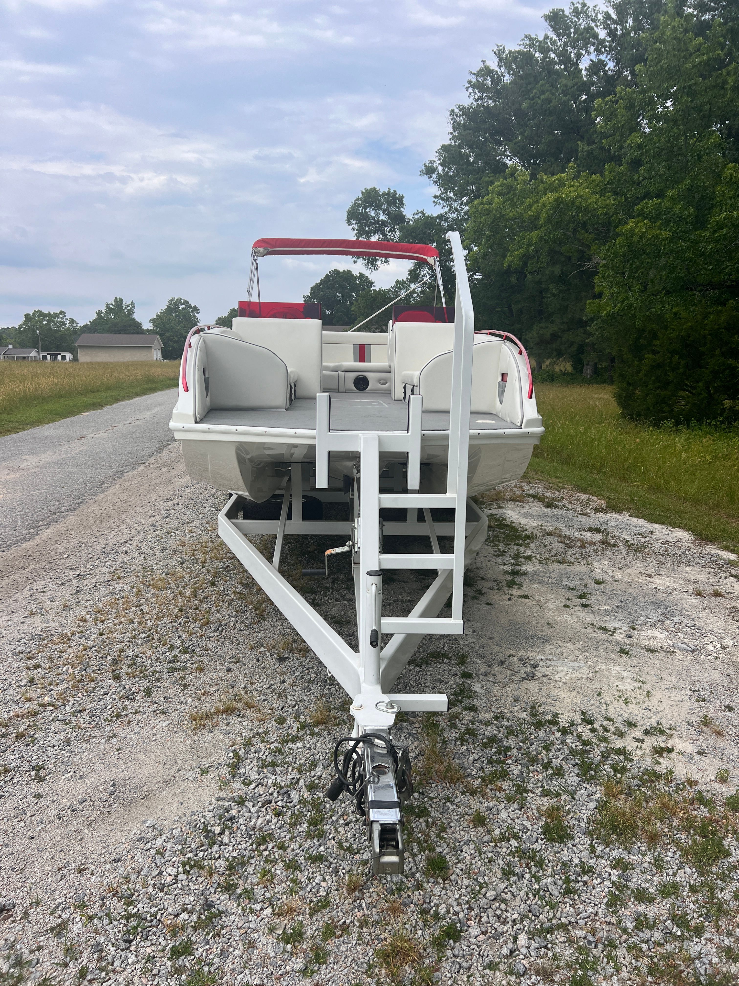 A 2008 Cheetah Fastcat on a trailer, parked on a gravel road.