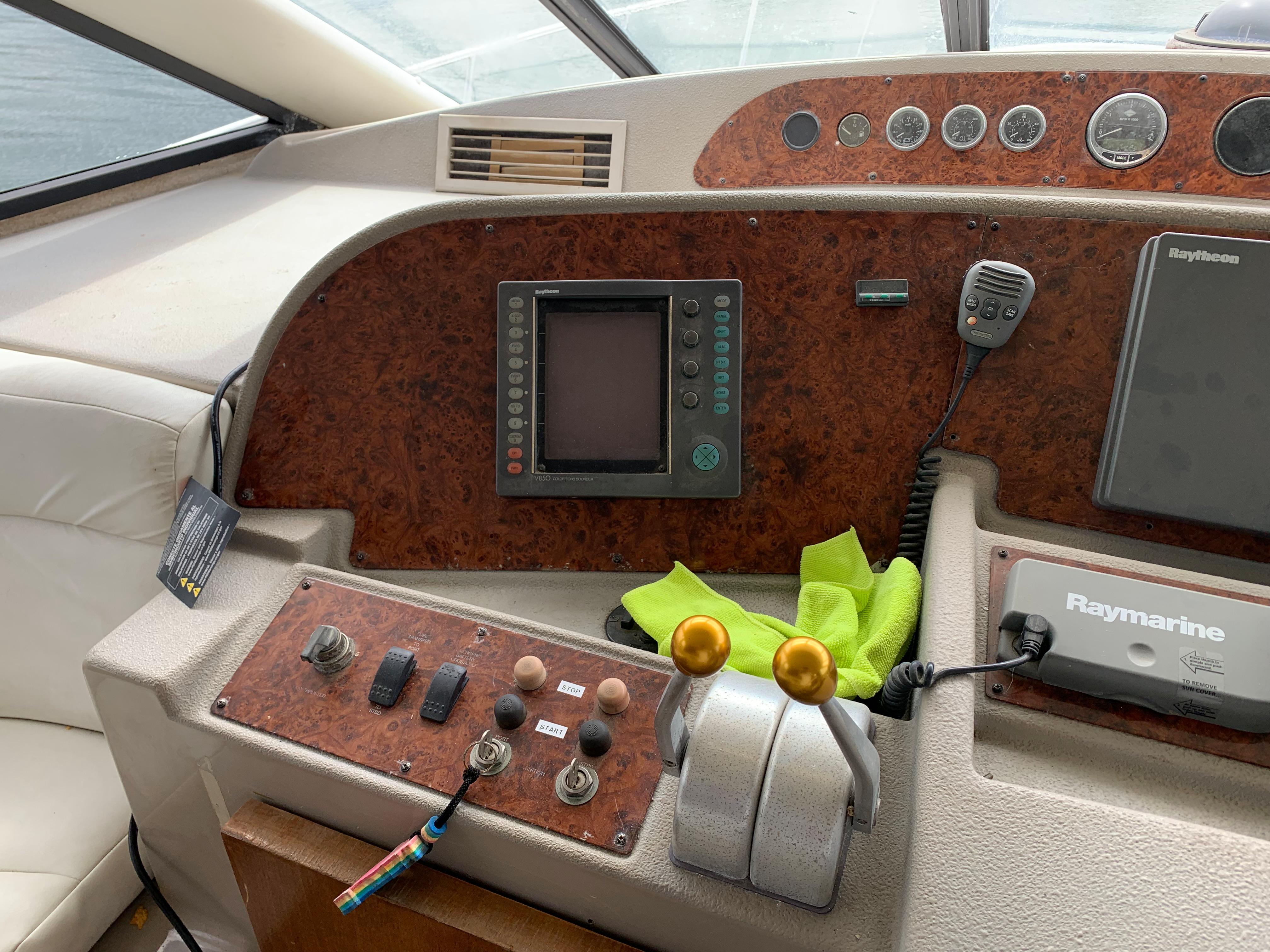 1999 Bayliner 5788 Pilot House Motoryacht helm with navigation controls and instruments.