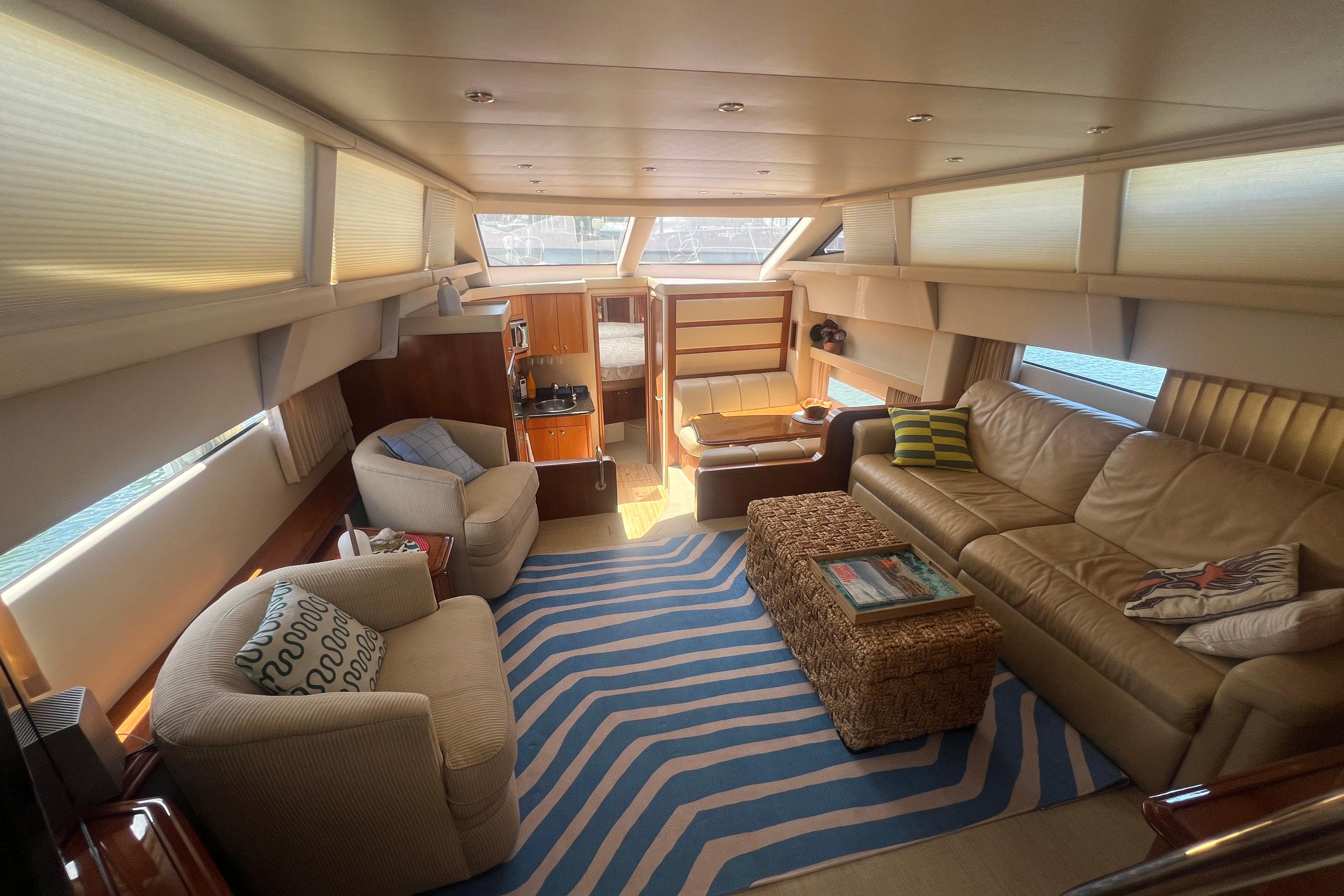 Luxurious interior of a 2006 Carver 43 Motor Yacht with cozy seating and nautical decor.