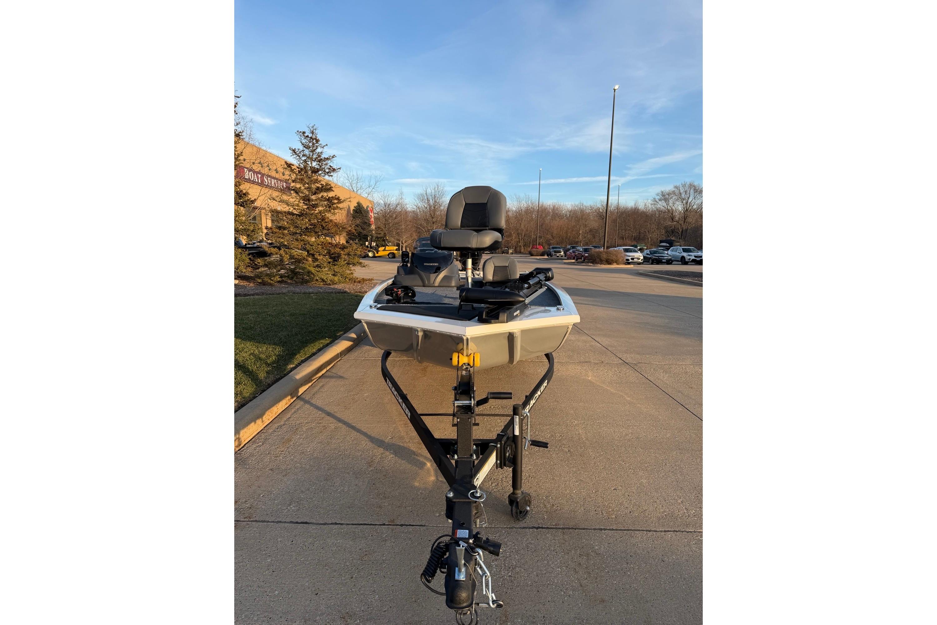 2026 Tracker Pro 170 boat on trailer in parking lot, sunny day.