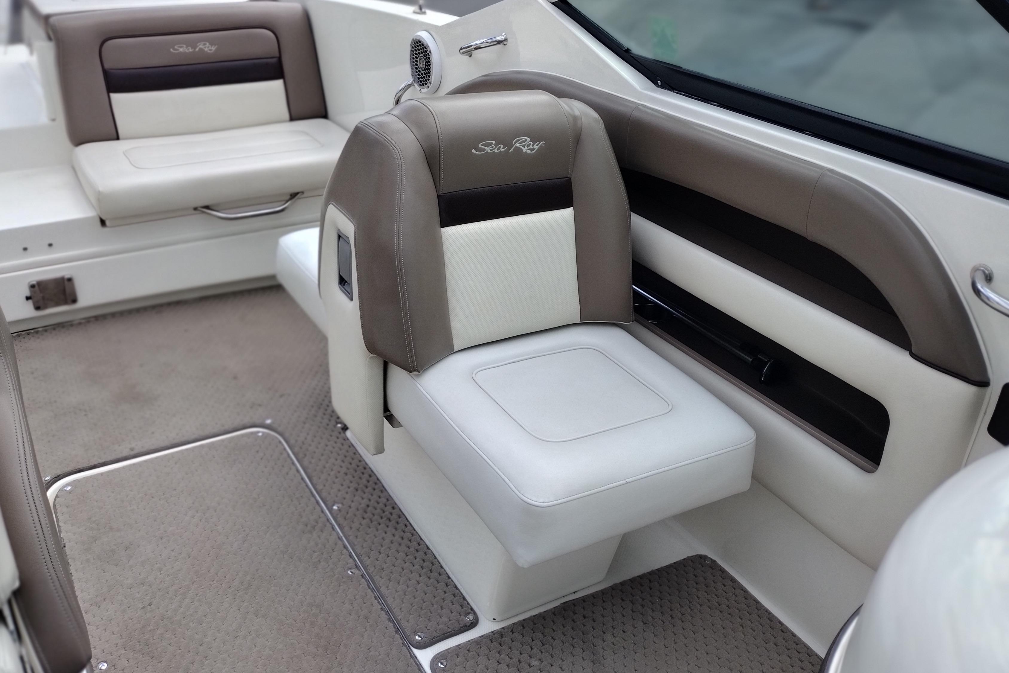 Interior of a 2013 Sea Ray 300 SLX boat with beige and white seating.