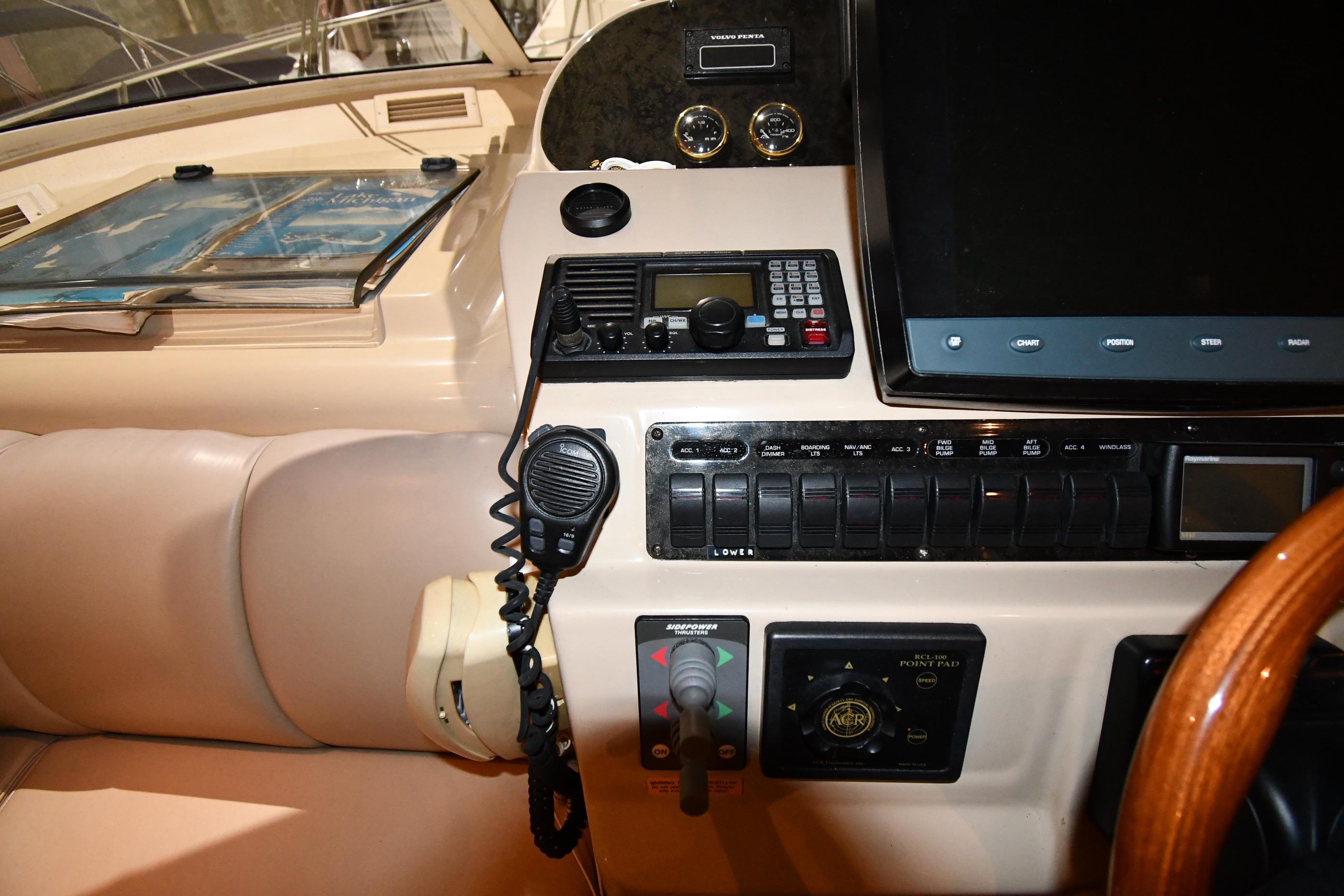2003 Cruisers Yachts 5000 Sedan Sport helm with navigation controls and communication equipment.