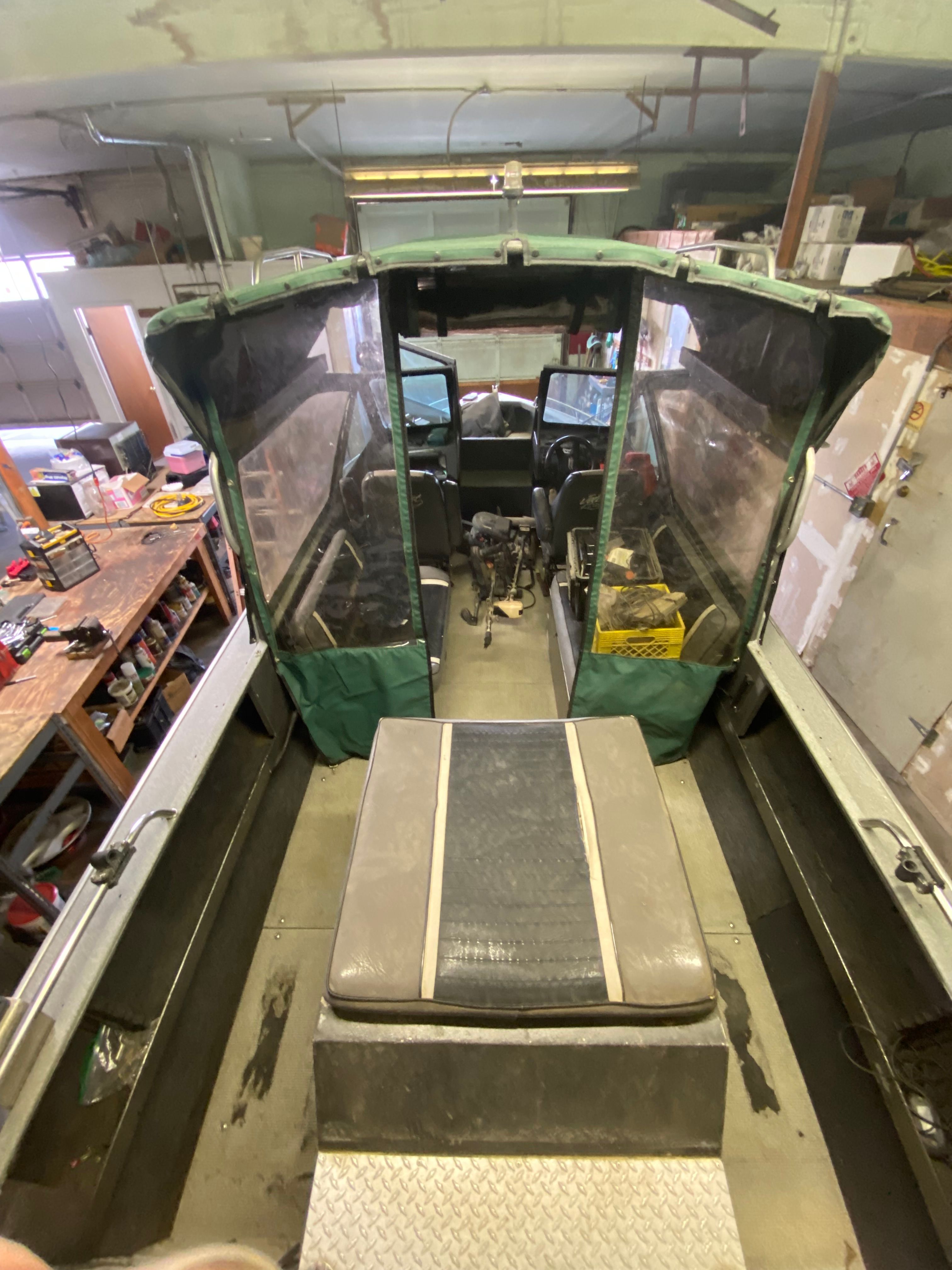 Interior view of a 1993 Jetcraft Fastwater boat in a workshop.