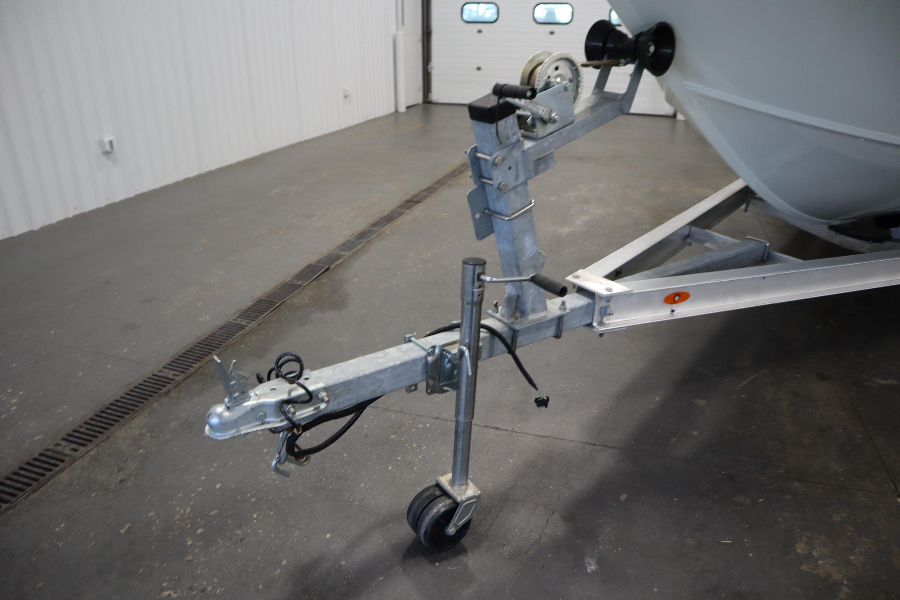Trailer hitch of a 2022 Crestliner 2200 CC boat in a garage setting.