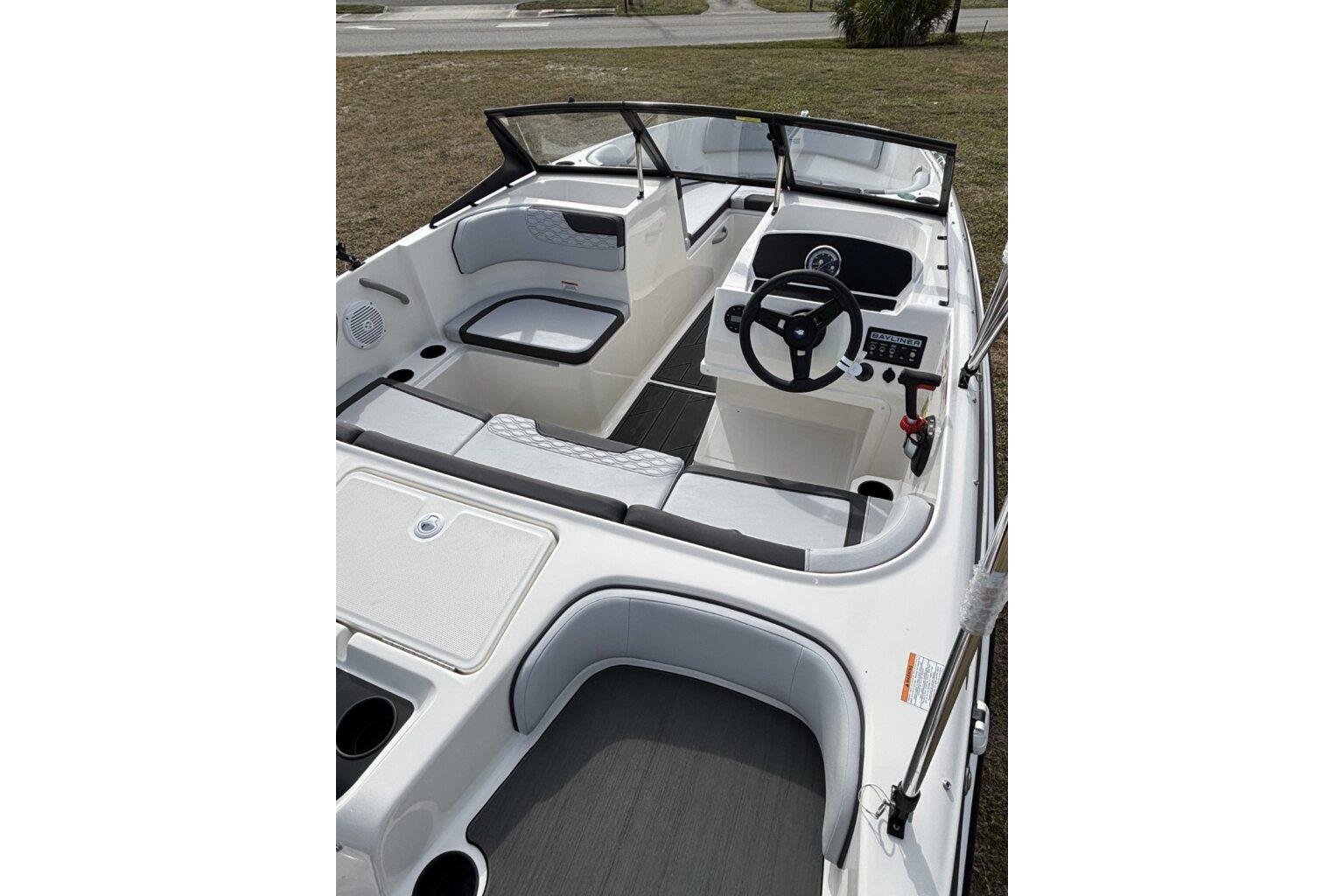2025 Bayliner Element M17 boat interior with seating and steering console.