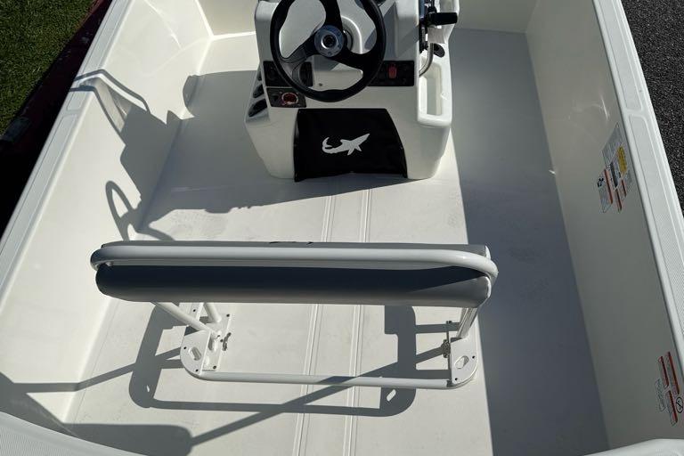 2026 Mako Pro Skiff 17 CC interior with steering console and seating.