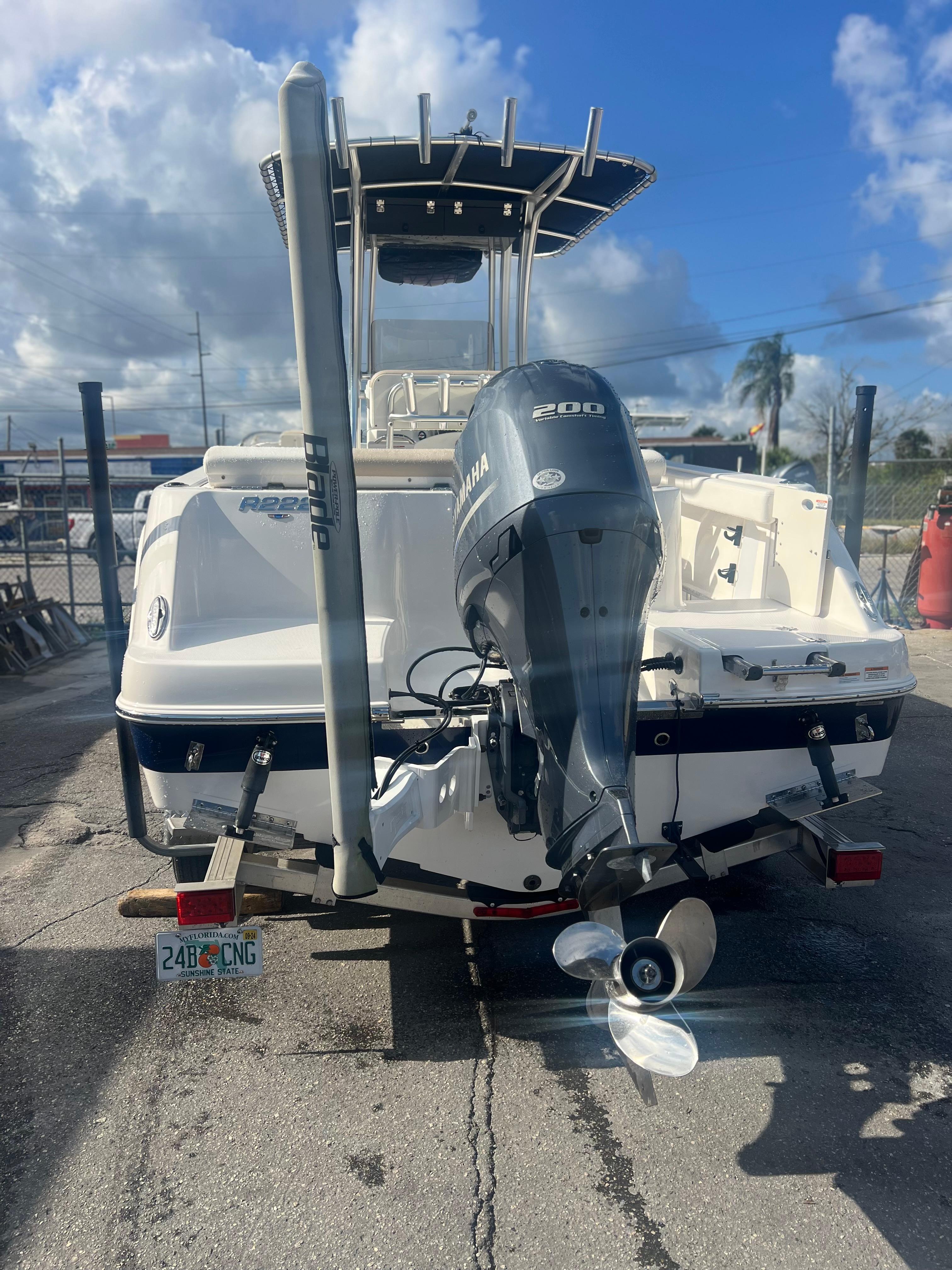 2022 Robalo R222 Center Console boat with Yamaha 200 engine, parked outdoors.