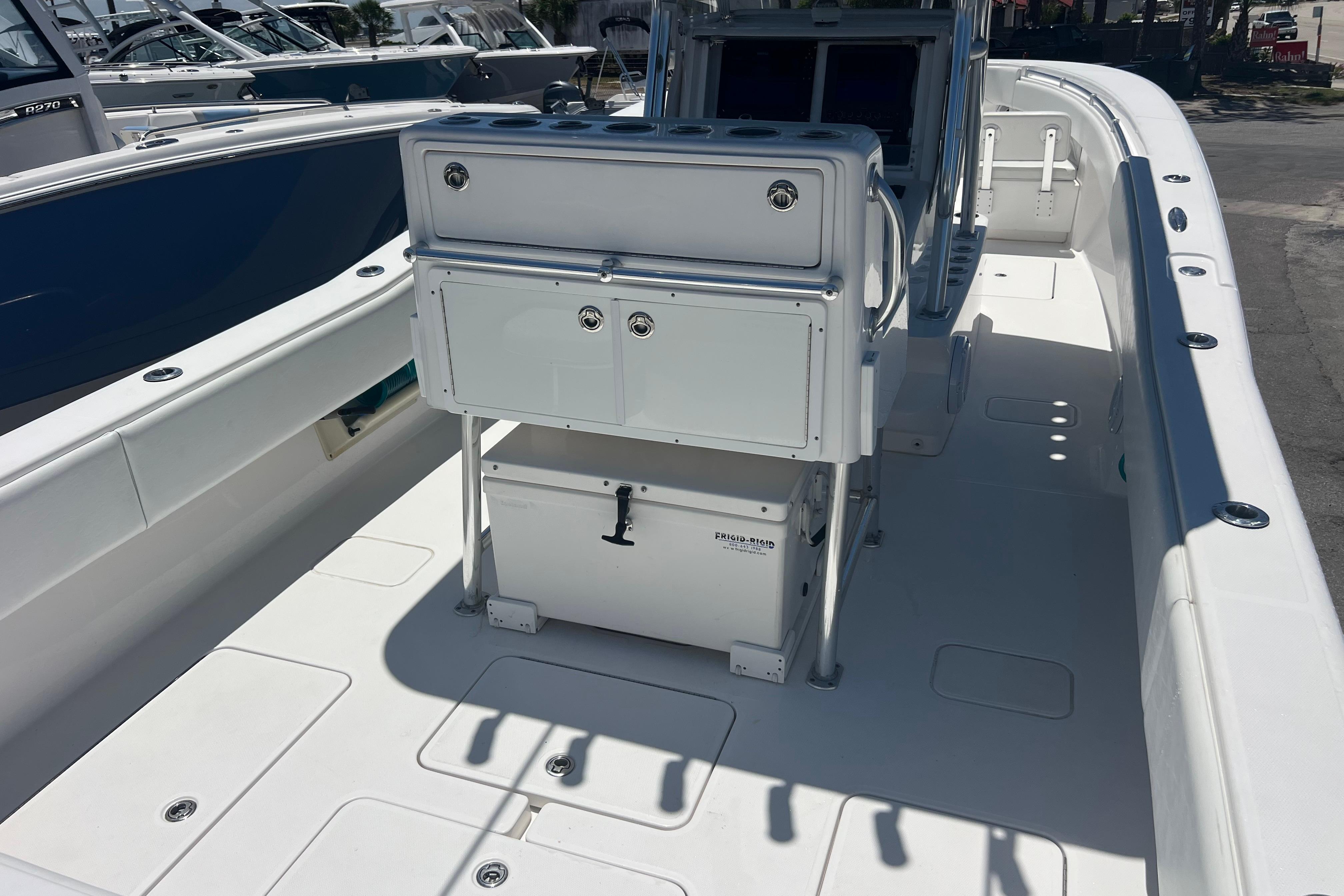 2012 Invincible 33 Open Fisherman boat interior with seating and storage.