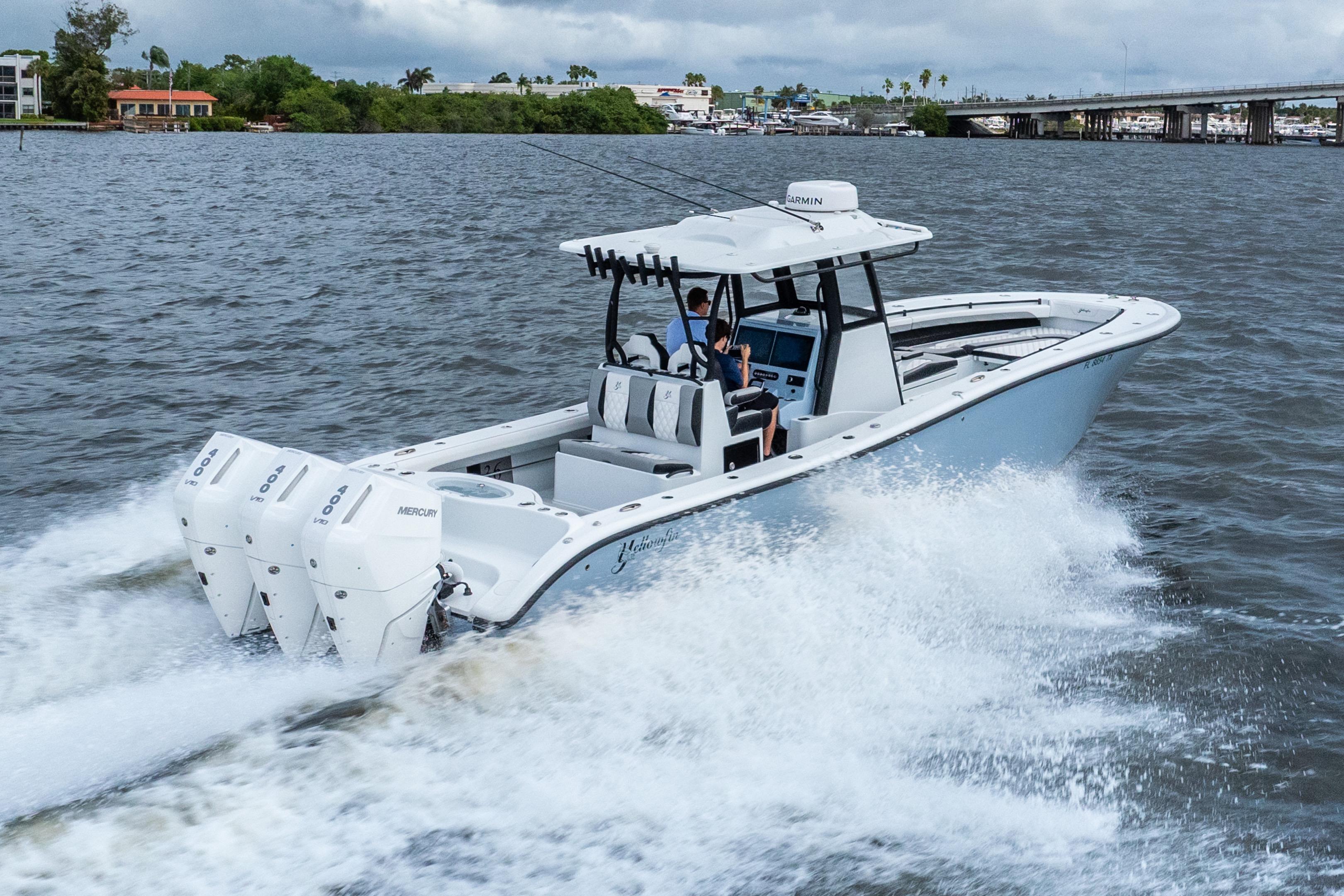2025 Yellowfin 36 Offshore boat cruising on open water with triple Mercury engines.