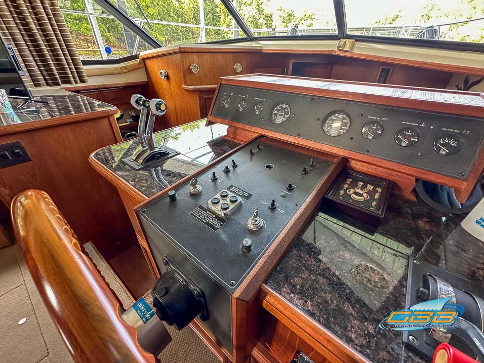 1989 Carver 3807 Aft Cabin helm with control panel and gauges.