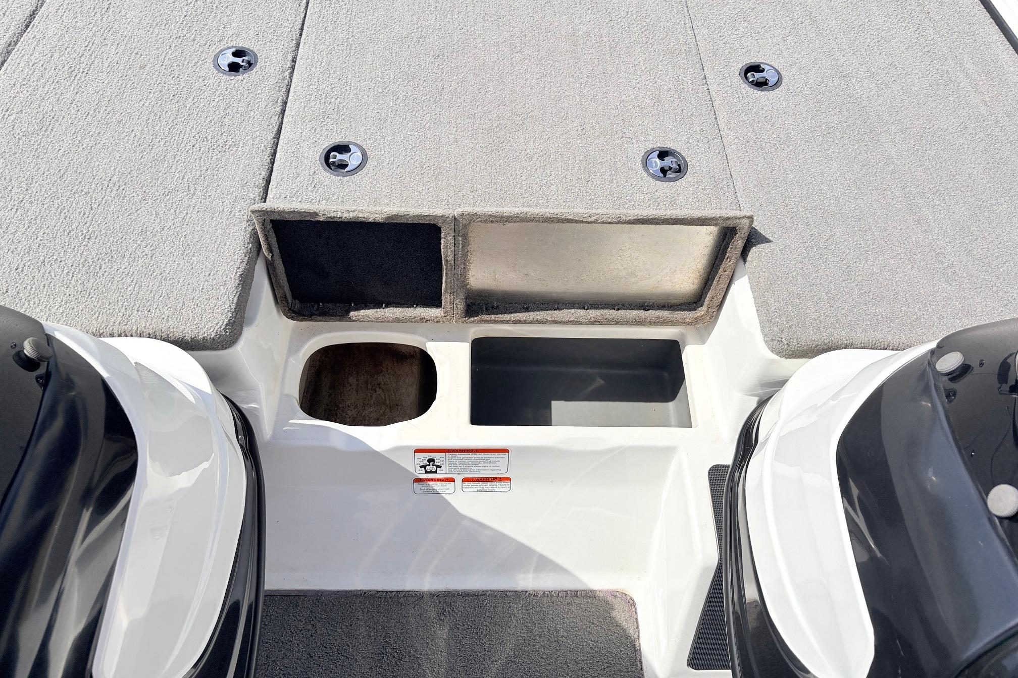 2011 Nitro Z-7 boat deck with storage compartments and carpeted surface.