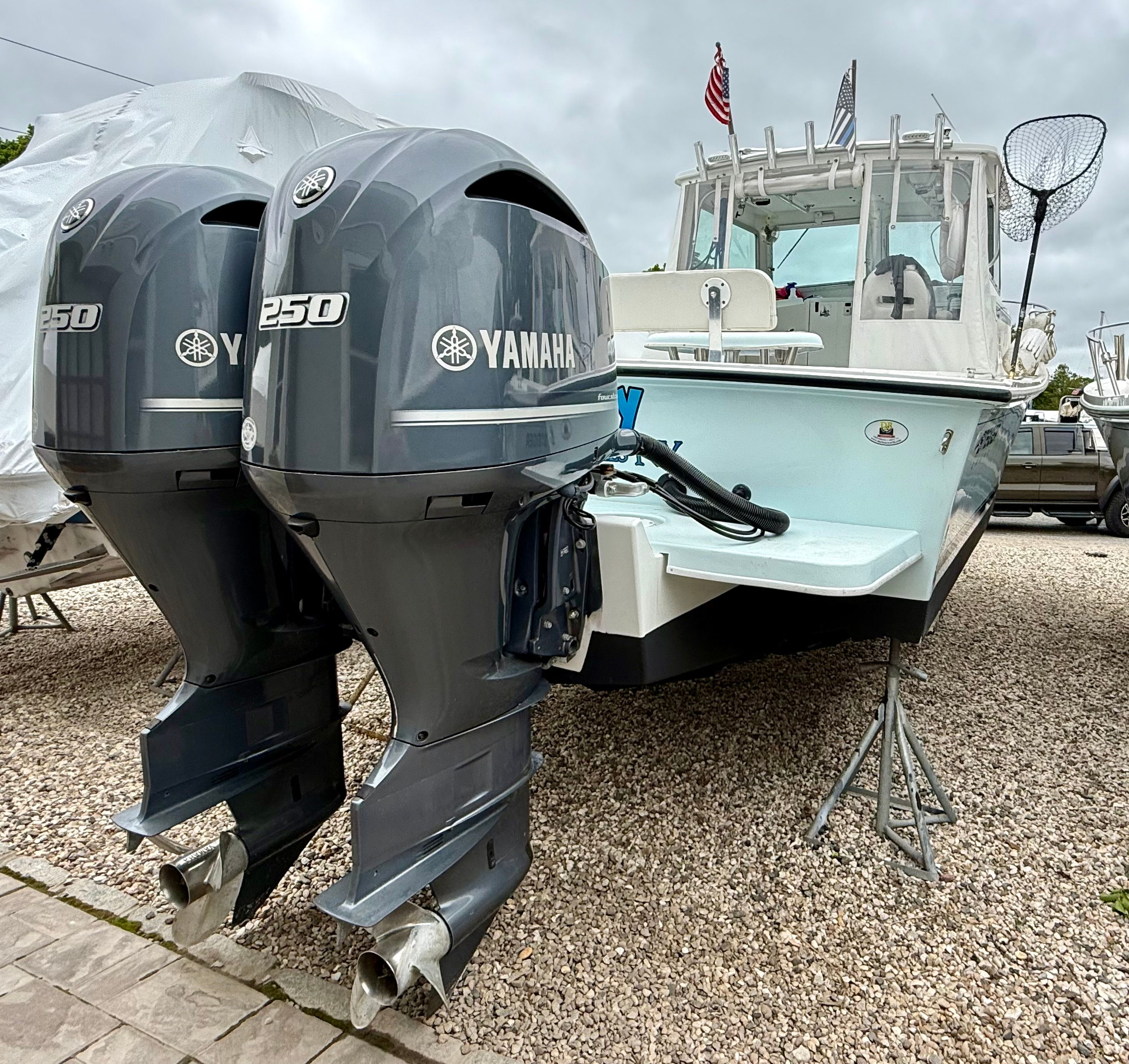 2019 Steiger Craft 28 Miami with twin Yamaha 250 engines on a gravel lot.