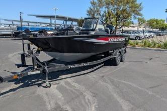 2026 Tracker Targa V-18 WT boat on trailer in parking lot.